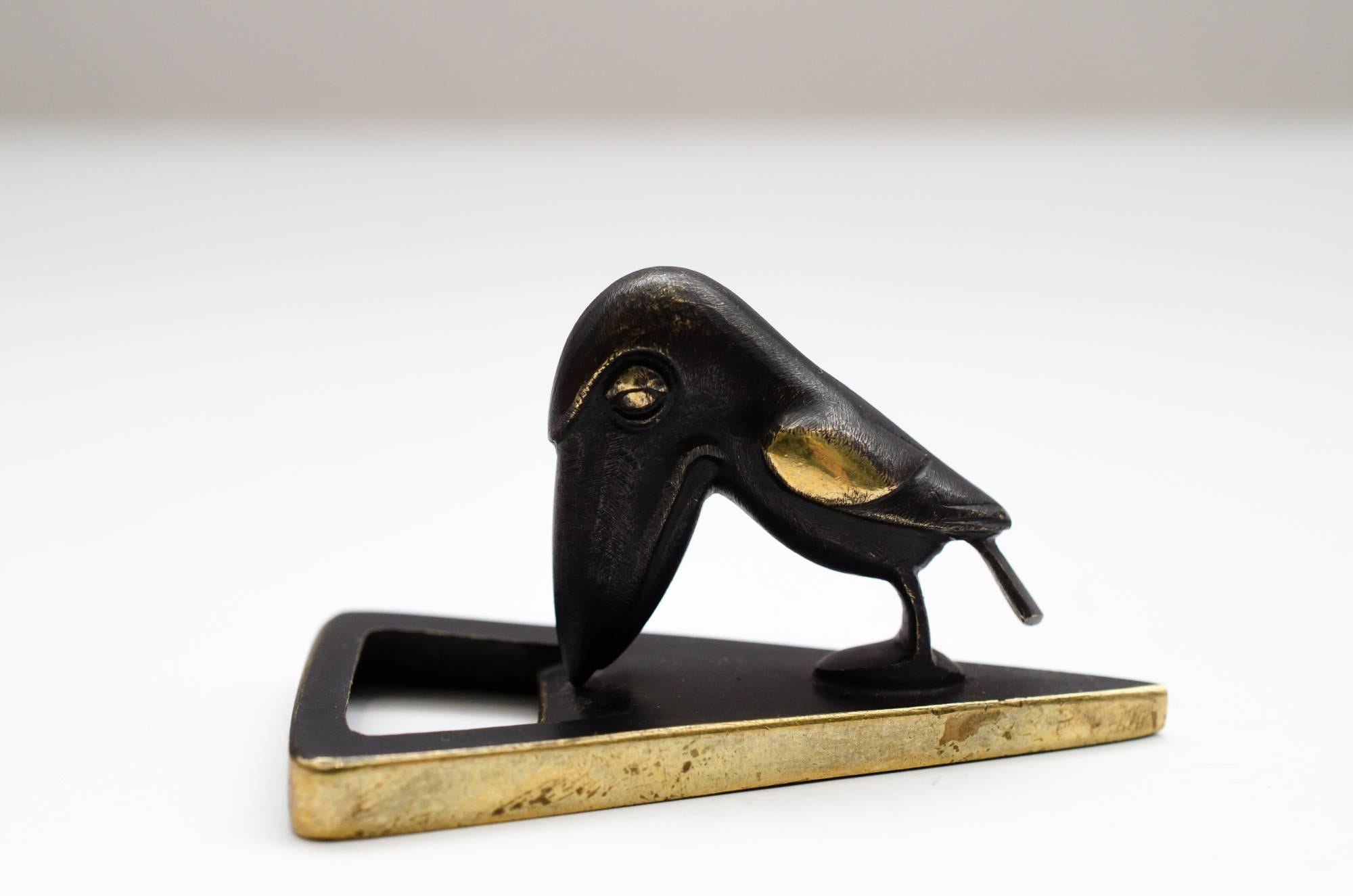 Bottle opener showing a raven by Richard Rohac
Original condition.