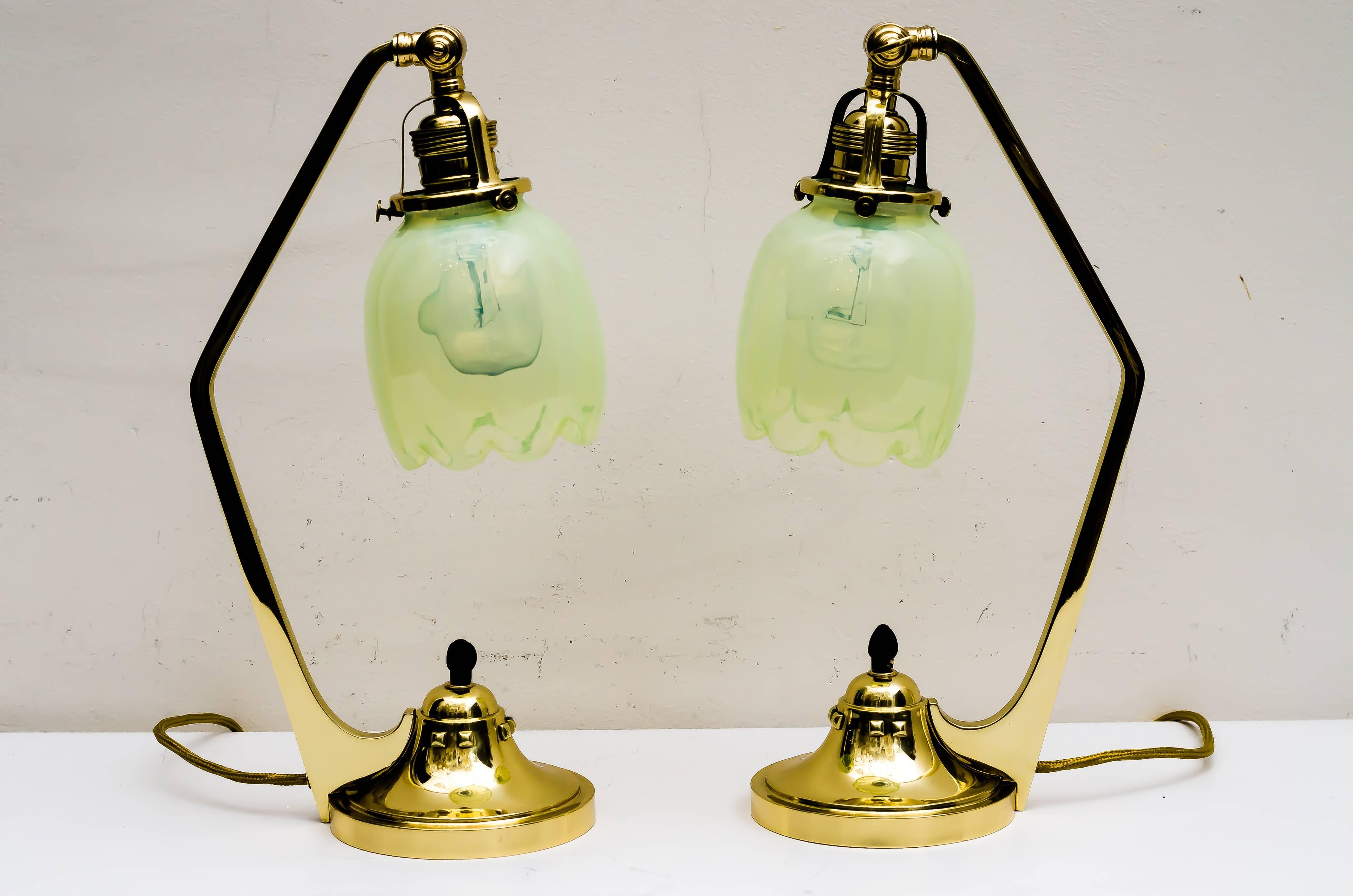 Two Jugendstil table lamps with beautiful opaline glass shades
polished and stove enameled.