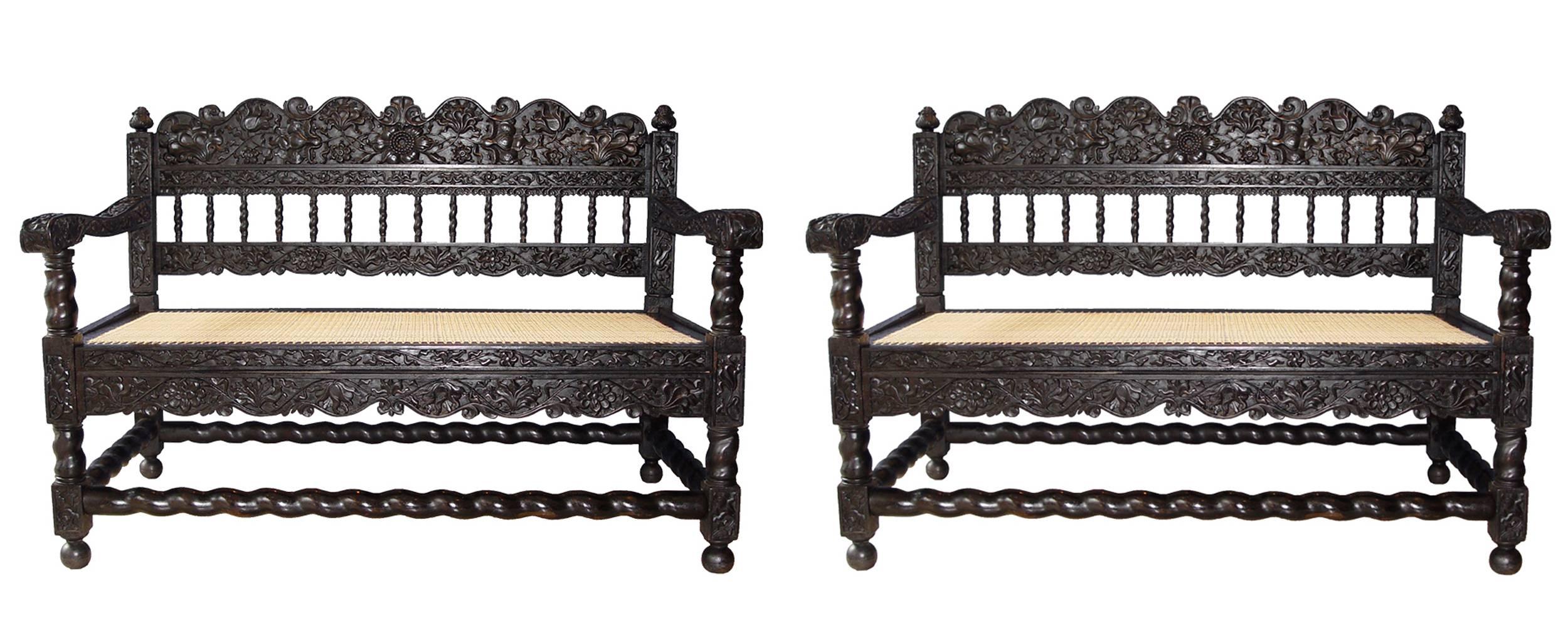 A very rare pair of ebony carved settees,
Indonesia, Java,
18th century (1680-1720).
Woven contemporary cane seat.
Measures: W 46 in x D 26.7in x seat Ht 15.7in x Ht of the back 33.07in.

Ancient Parisian collection.
Very good