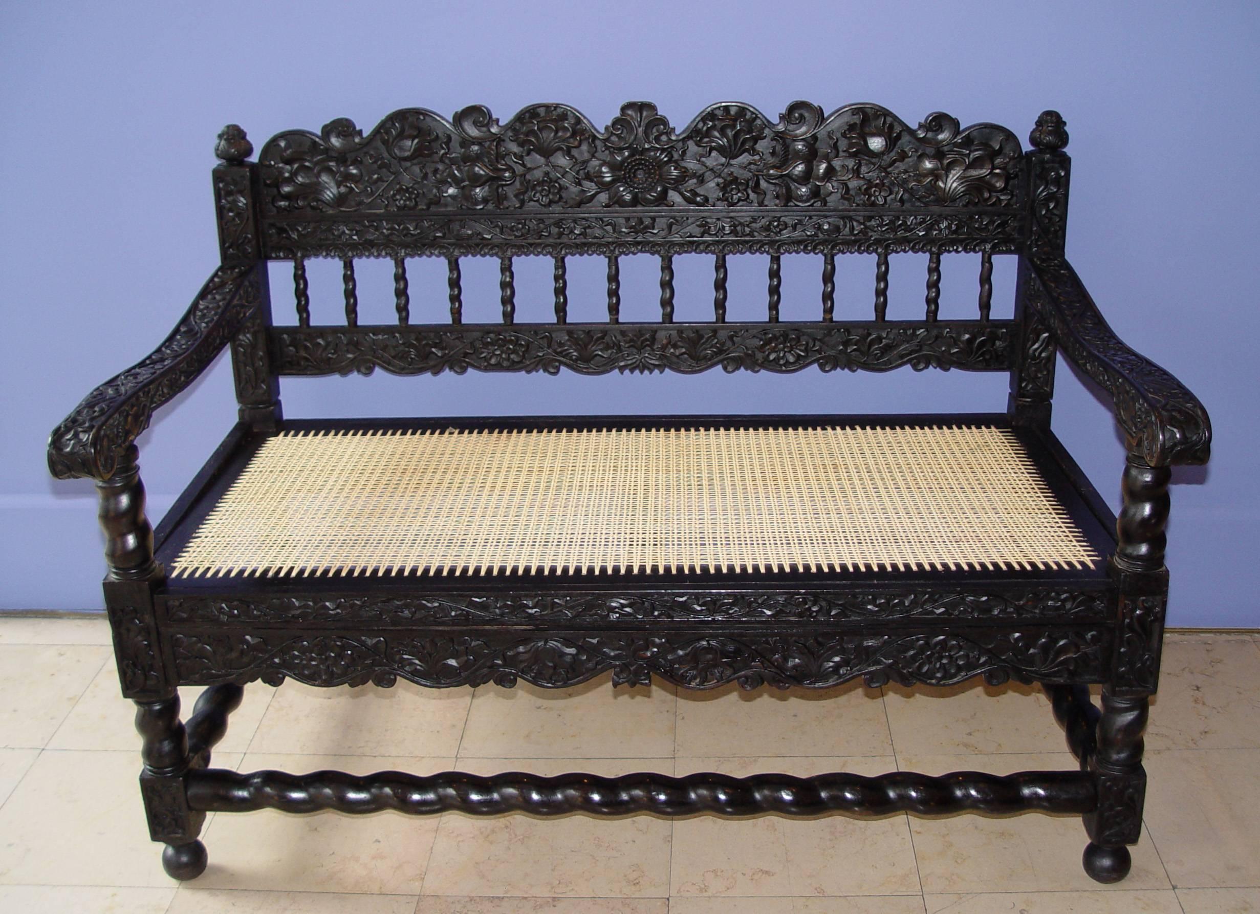 Dutch Colonial Very Rare Pair of Early 18th Indonesian Ebony Carved Settees For Sale