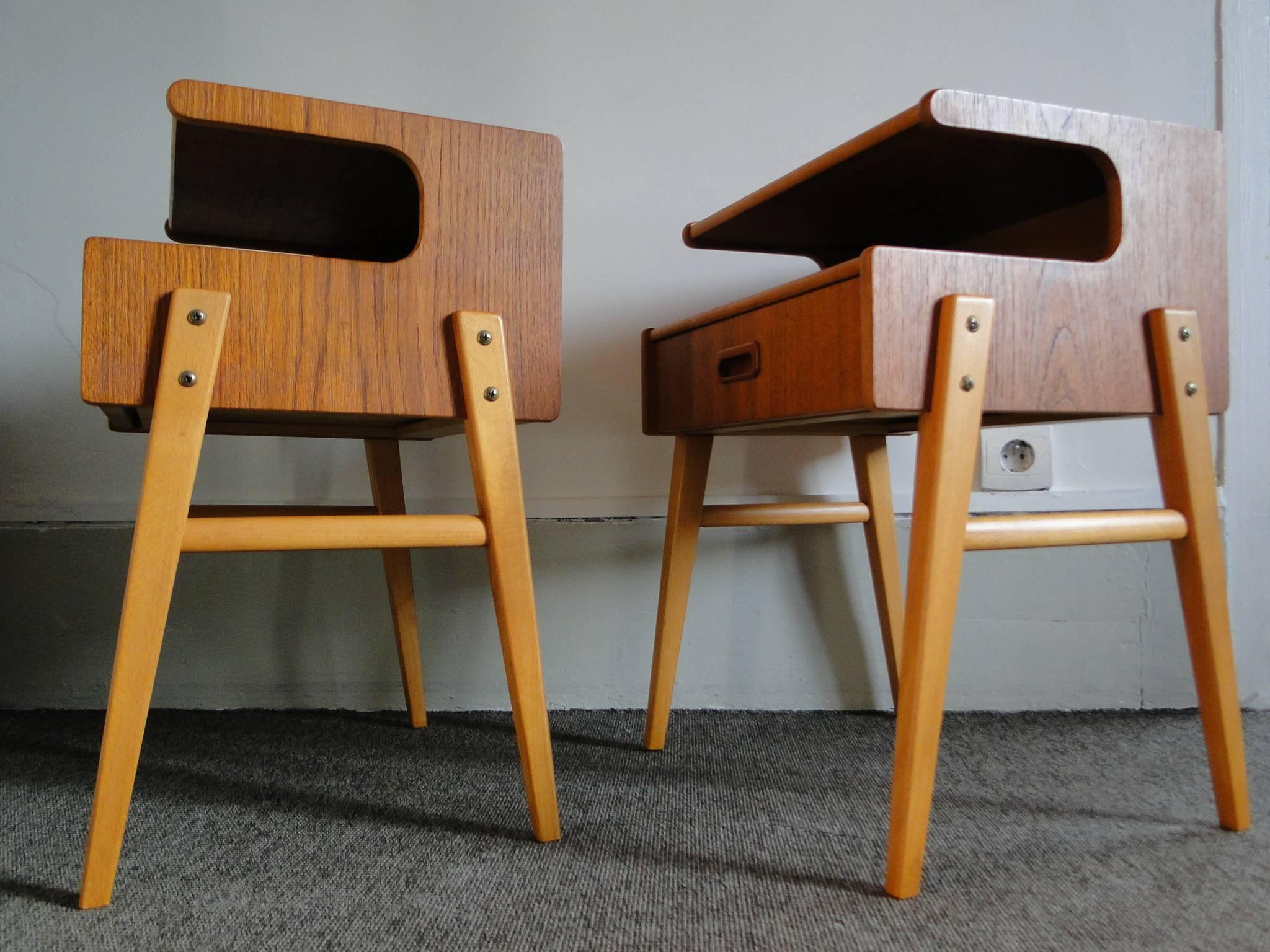 Pair of Classic nightstands by Børge Mogensen for Soborg Mobler, Denmark, circa 1960s. Teak with white laminate drop fronts. Open shelf above drop front for extra storage.