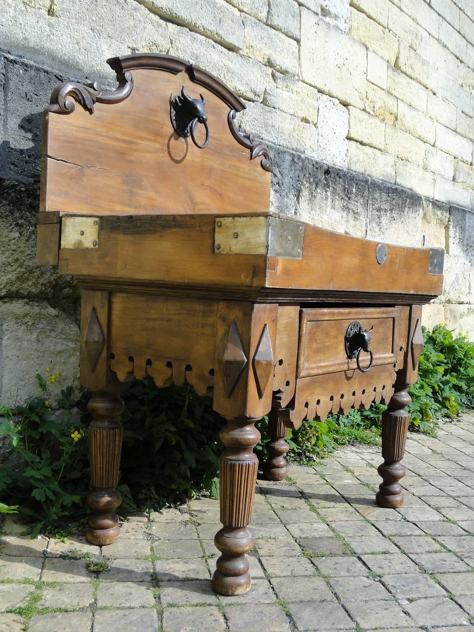 Beautiful 19th century Vergne and Cie butcher block from Paris, France. Carved scalloped apron over one large drawers and four fluted legs.