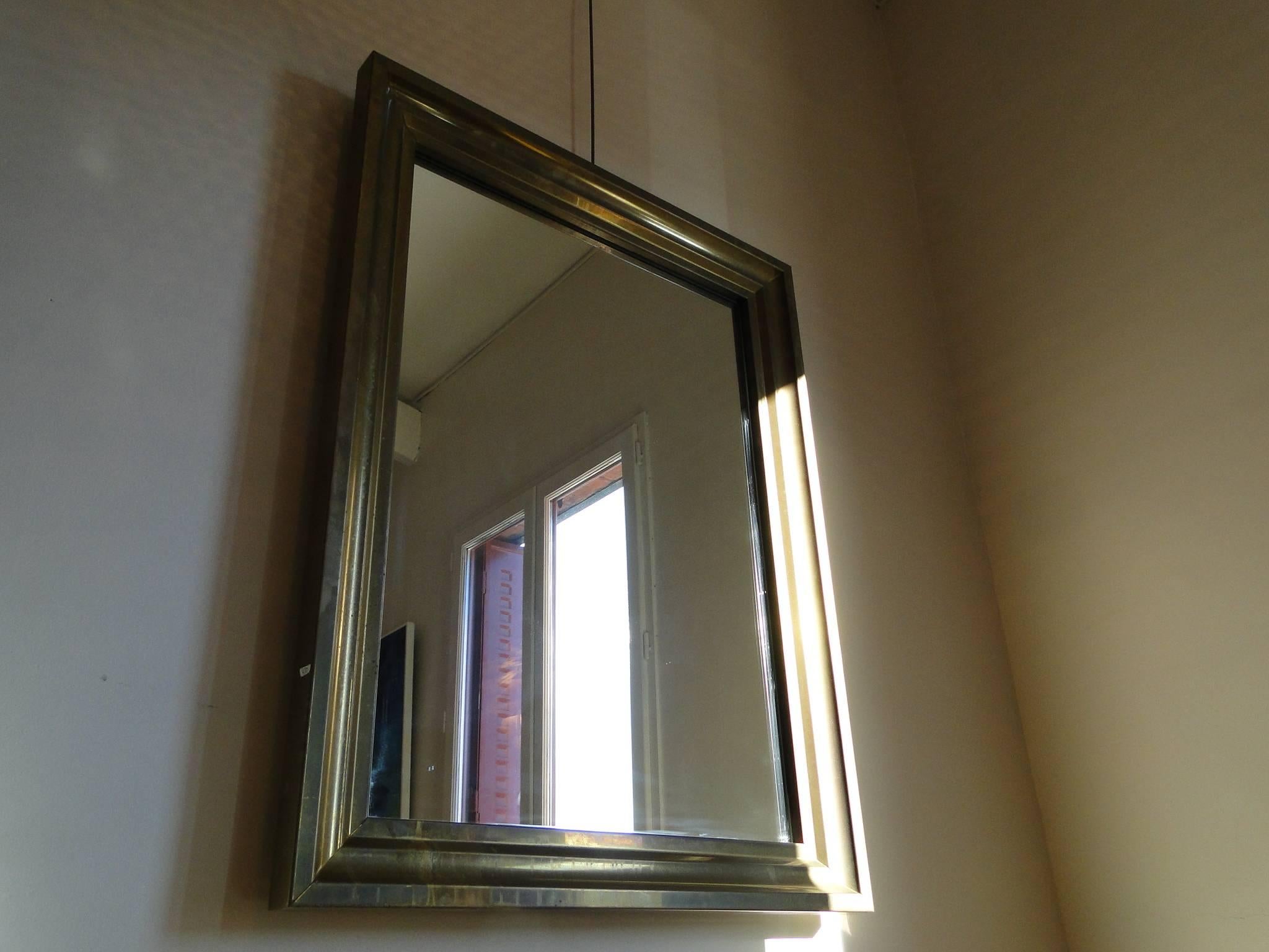 Large-scale Mid-Century French brass mirror with geometric detail. Brass is in excellent condition.