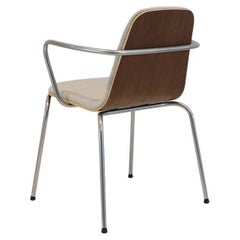 Stackable arm chairs in mid century style, modern and made new.