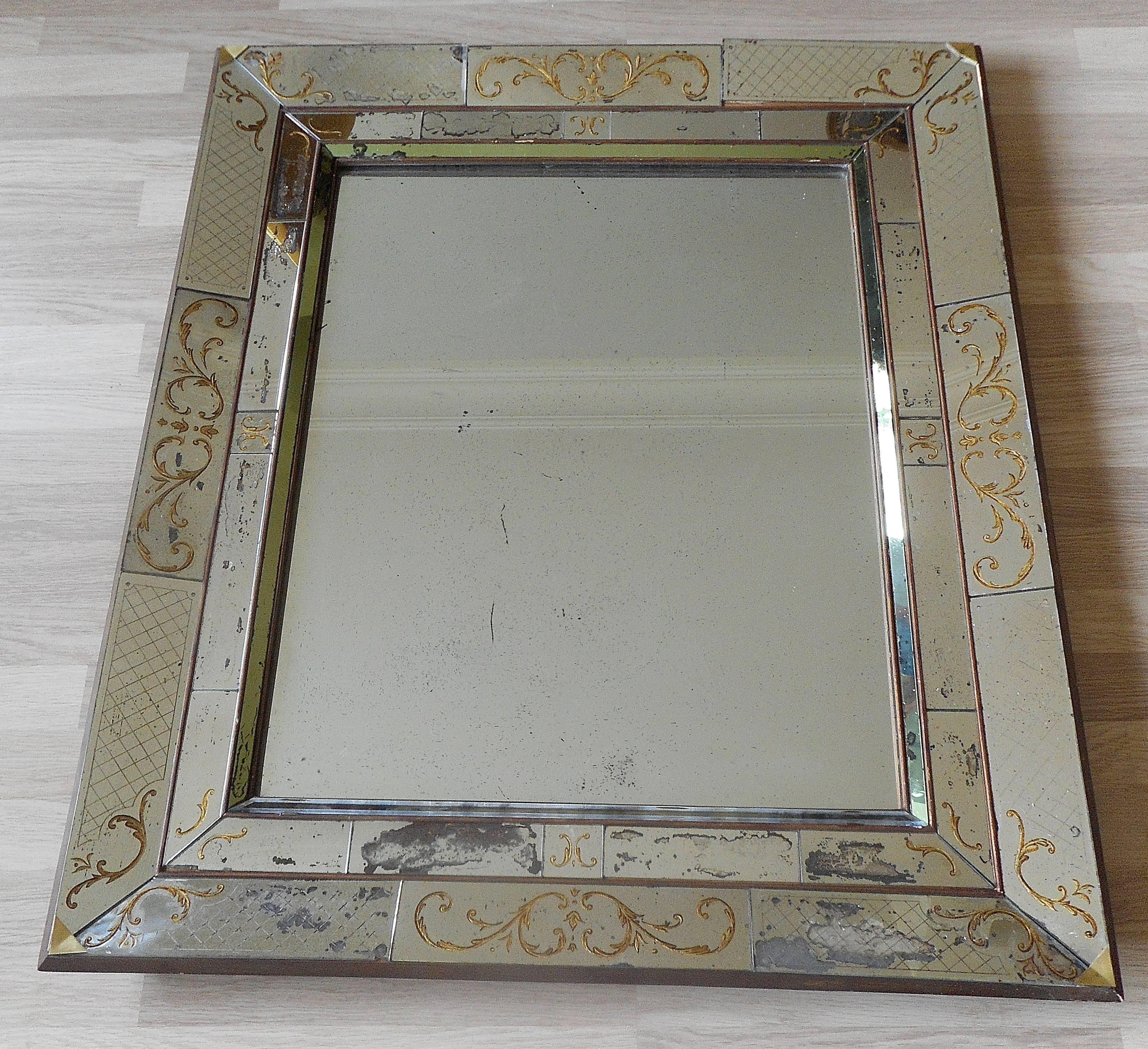 Aged and patinated églomisé mirror,probably made by Max Ingrand for Jansen.
Circa 1940.

 