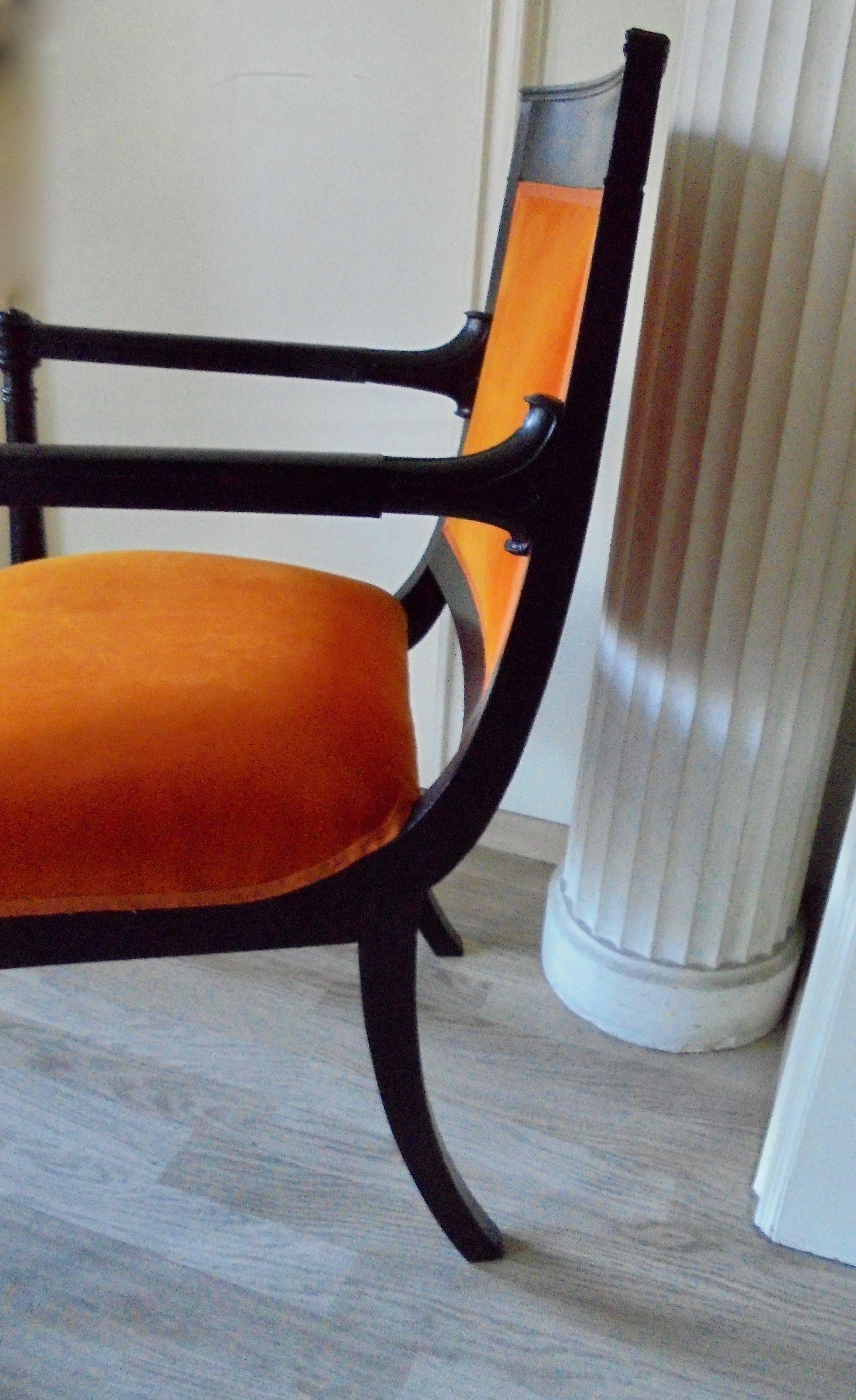 Black lacquer Empire armchair newly covered with " Hermès orange" velvet.
Circa 1935.
