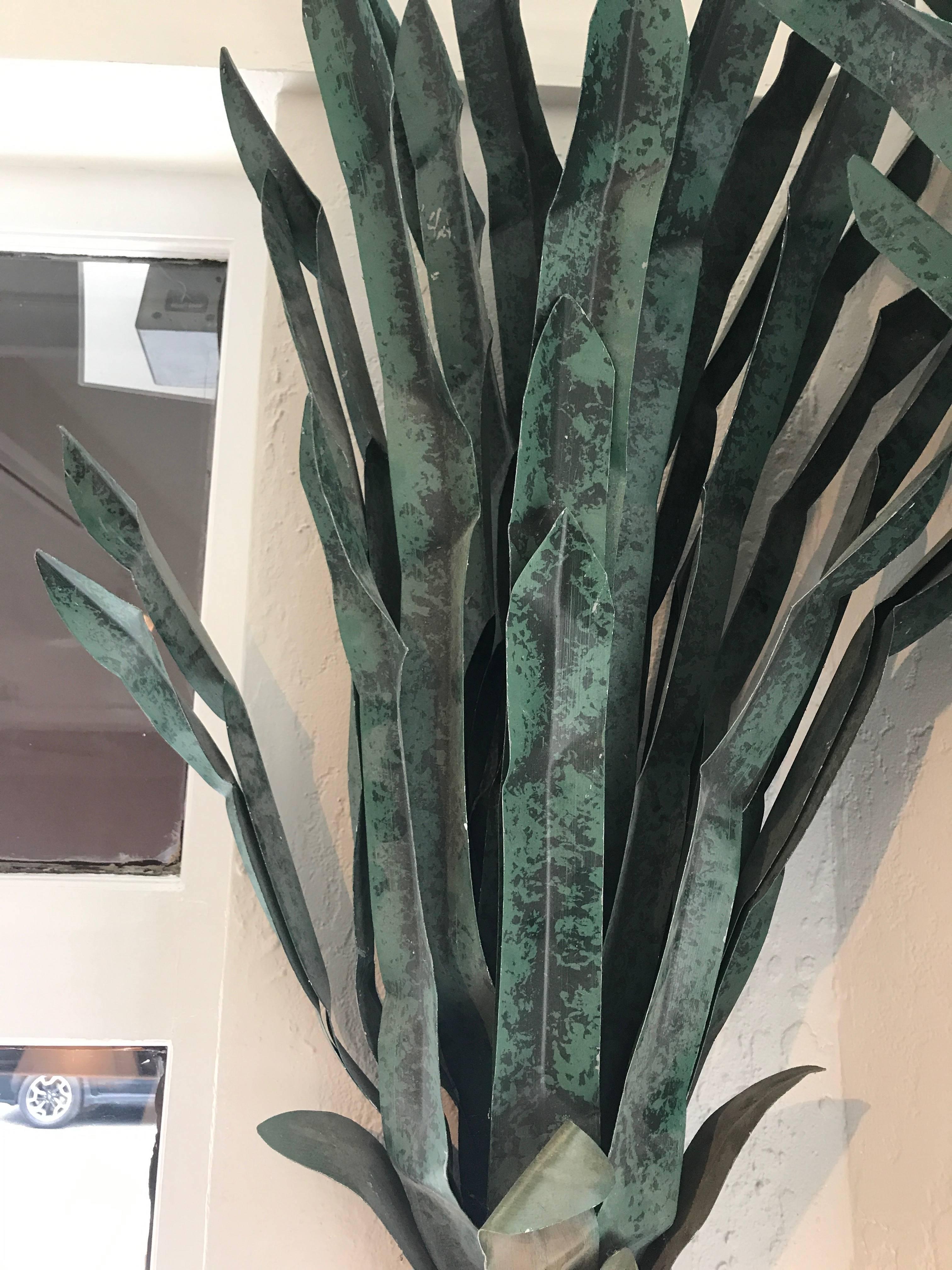 Set of four monumental sculpted tole wall-mounted palm trees.
 