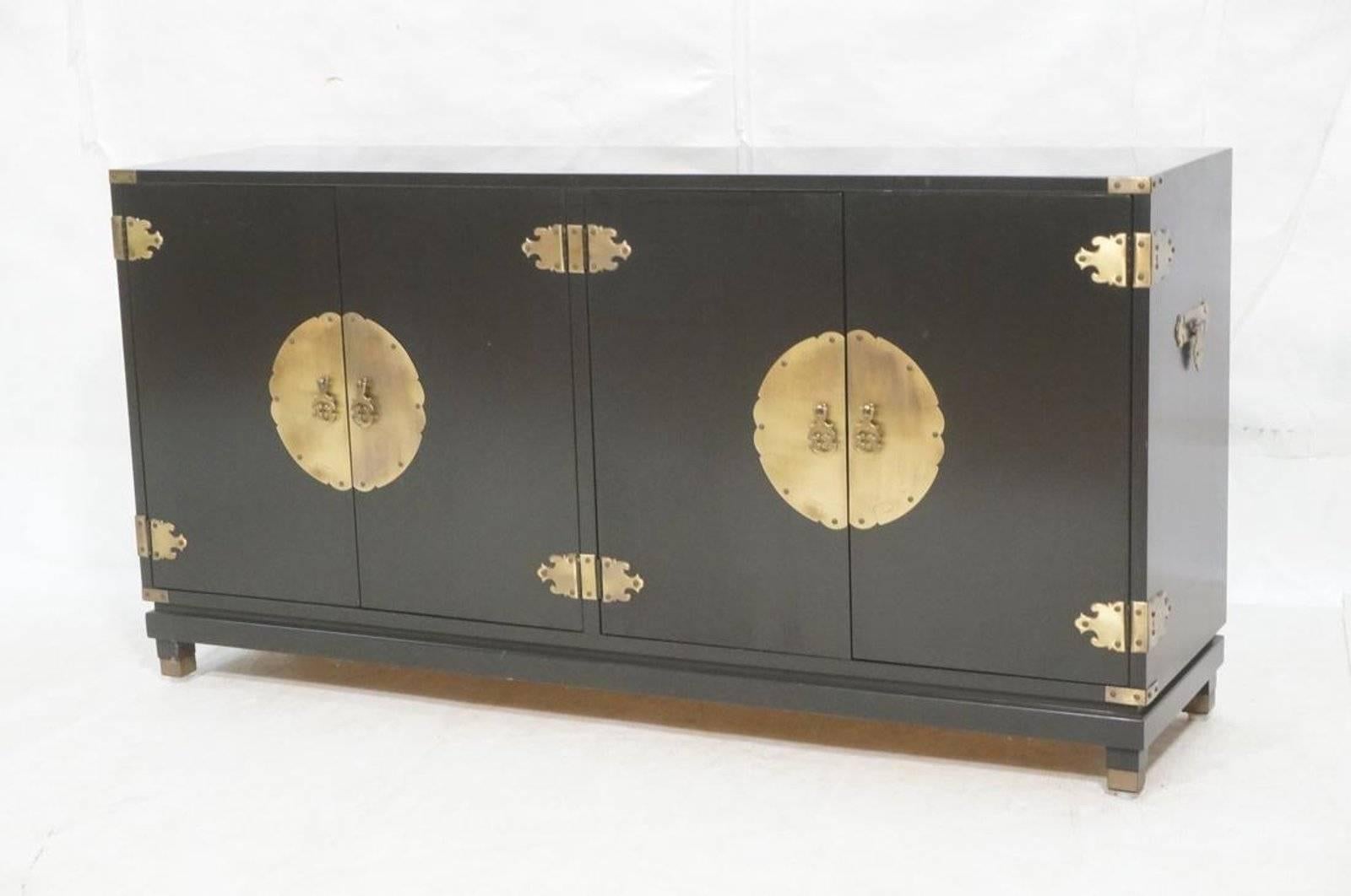 Ebonized chinoiserie four-door credenza with brass hardware.