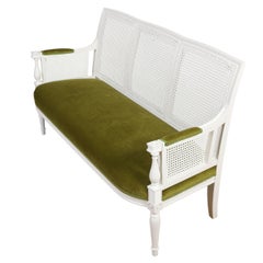 French Louis XVI Style Painted Cane Settee With Green Velvet Seat