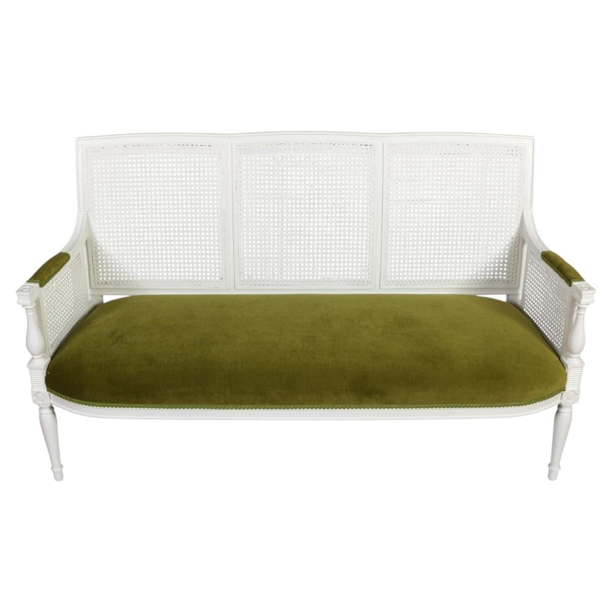 French Louis XVI Style Painted Cane Settee With Green Velvet Seat For Sale