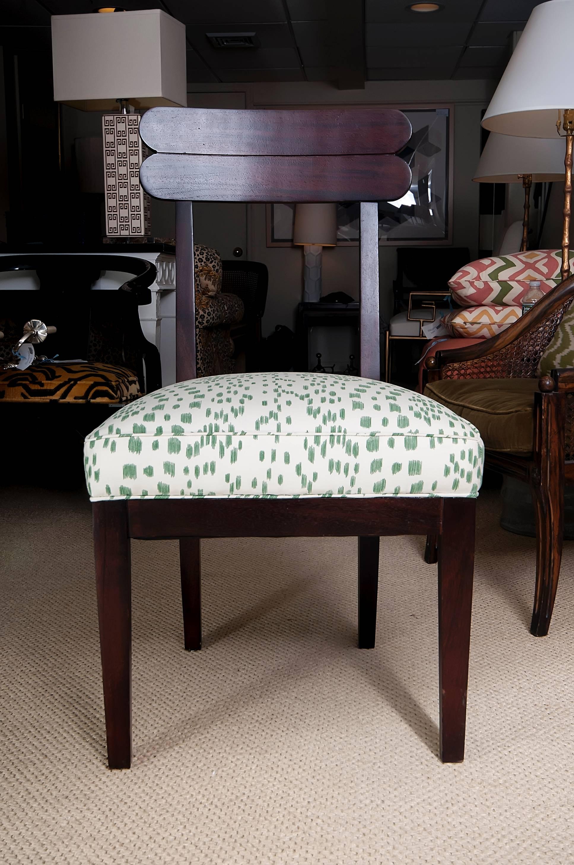 Set of four mahogany side chairs reupholstered in Brunschwig & Fils.