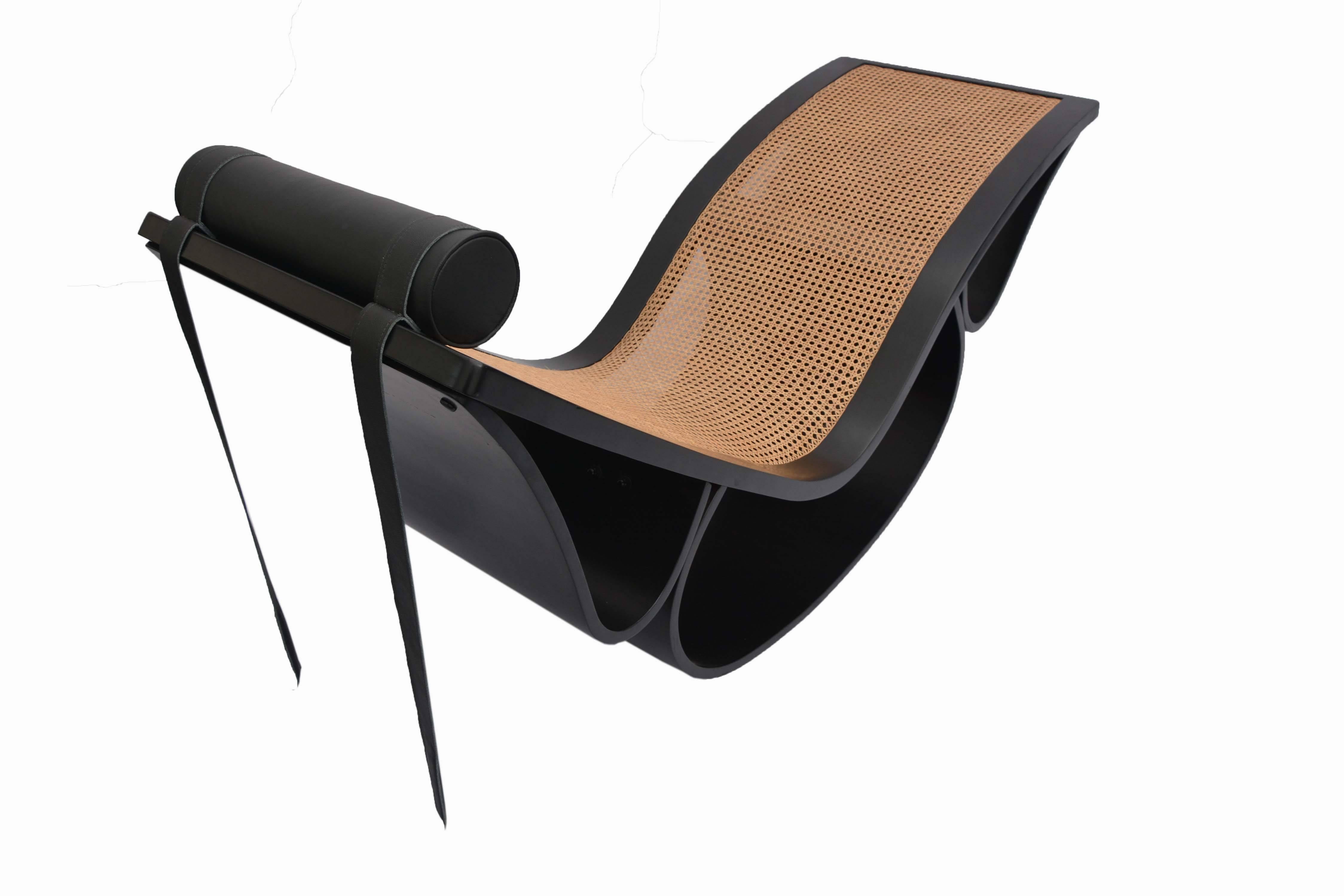 An amazing example of Oscar Niemeyer's design: All original vintage chaise longue in bentwood and caning with a counter balanced leather headrest.