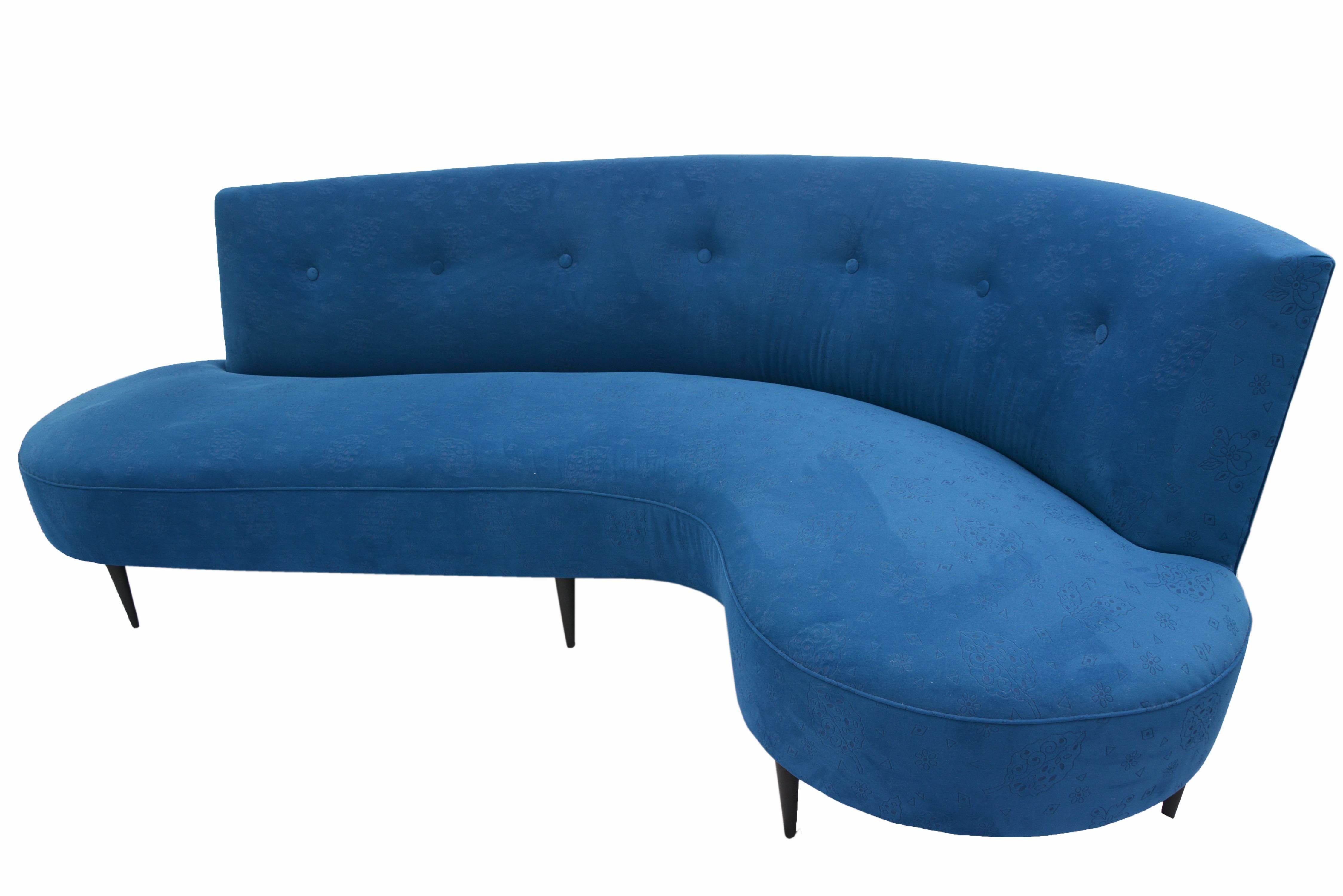 Comfortable, large and amazing curved sofa upholstered in sky blue velvet.