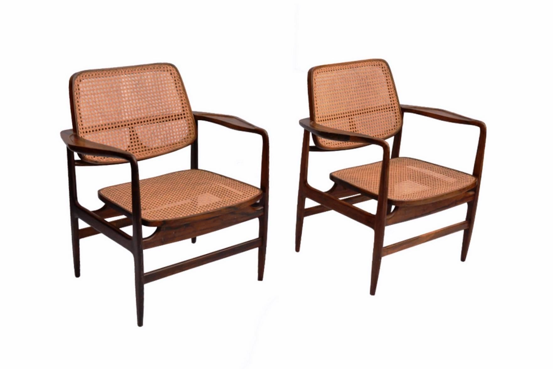 Original set of 12 Oscar armchair in Jacaranda wood and cane seating.