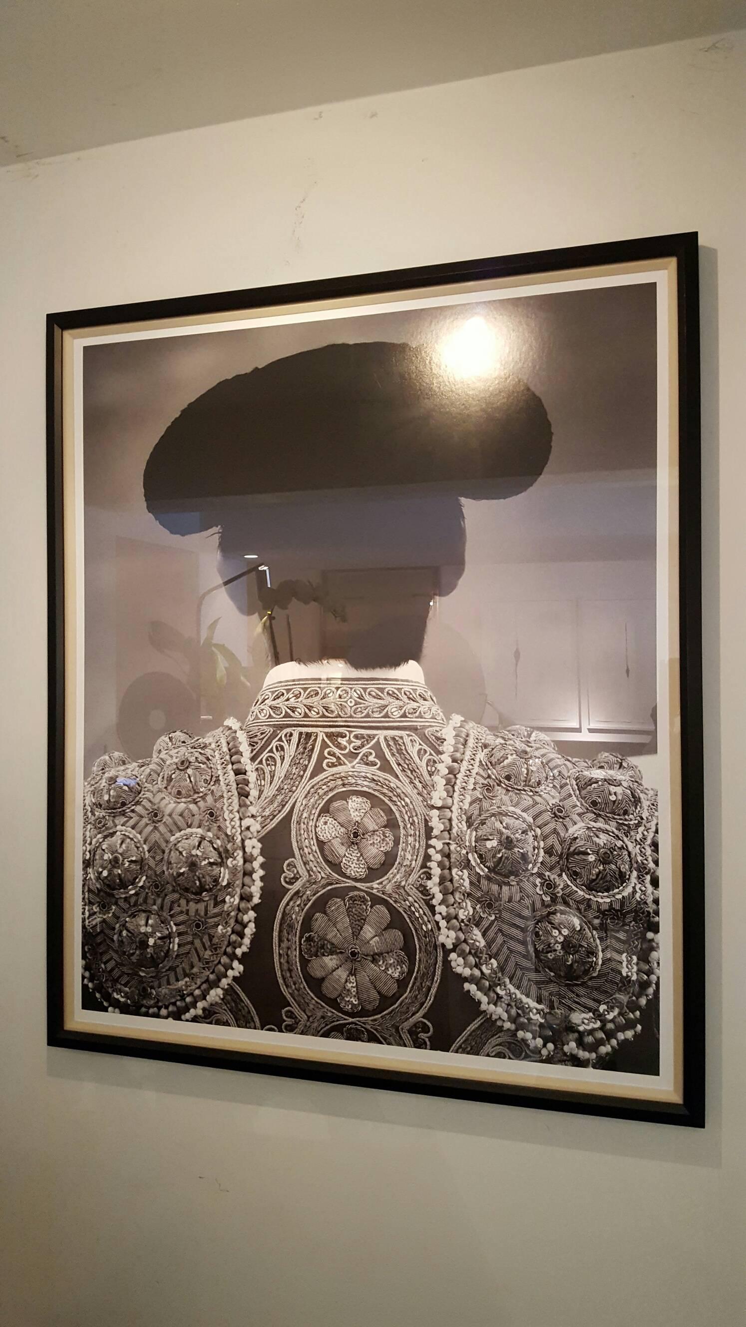 Beautiful art work matador in black frame.