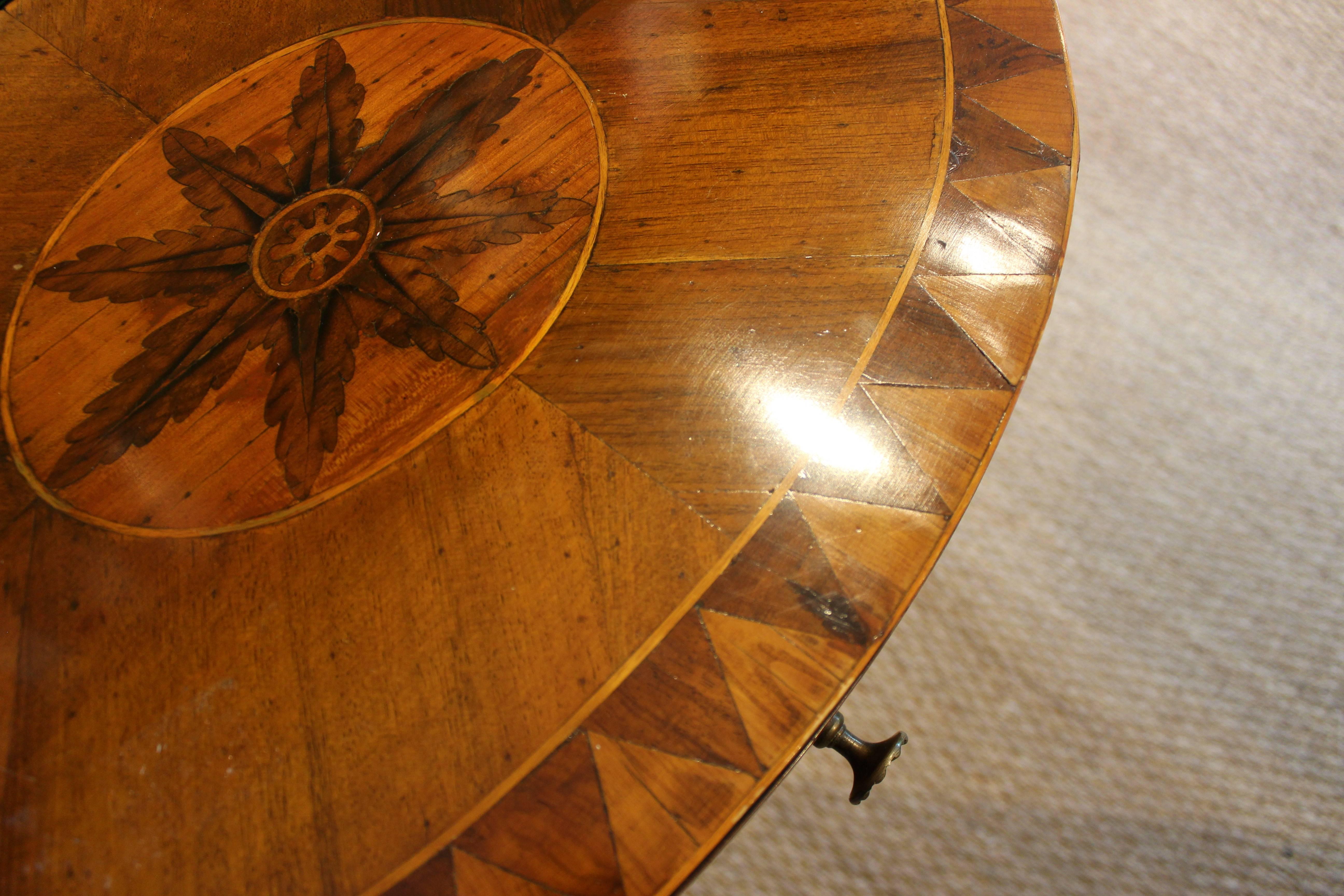 Beautifully inlaid walnut demilune table with drawer and original hardware.