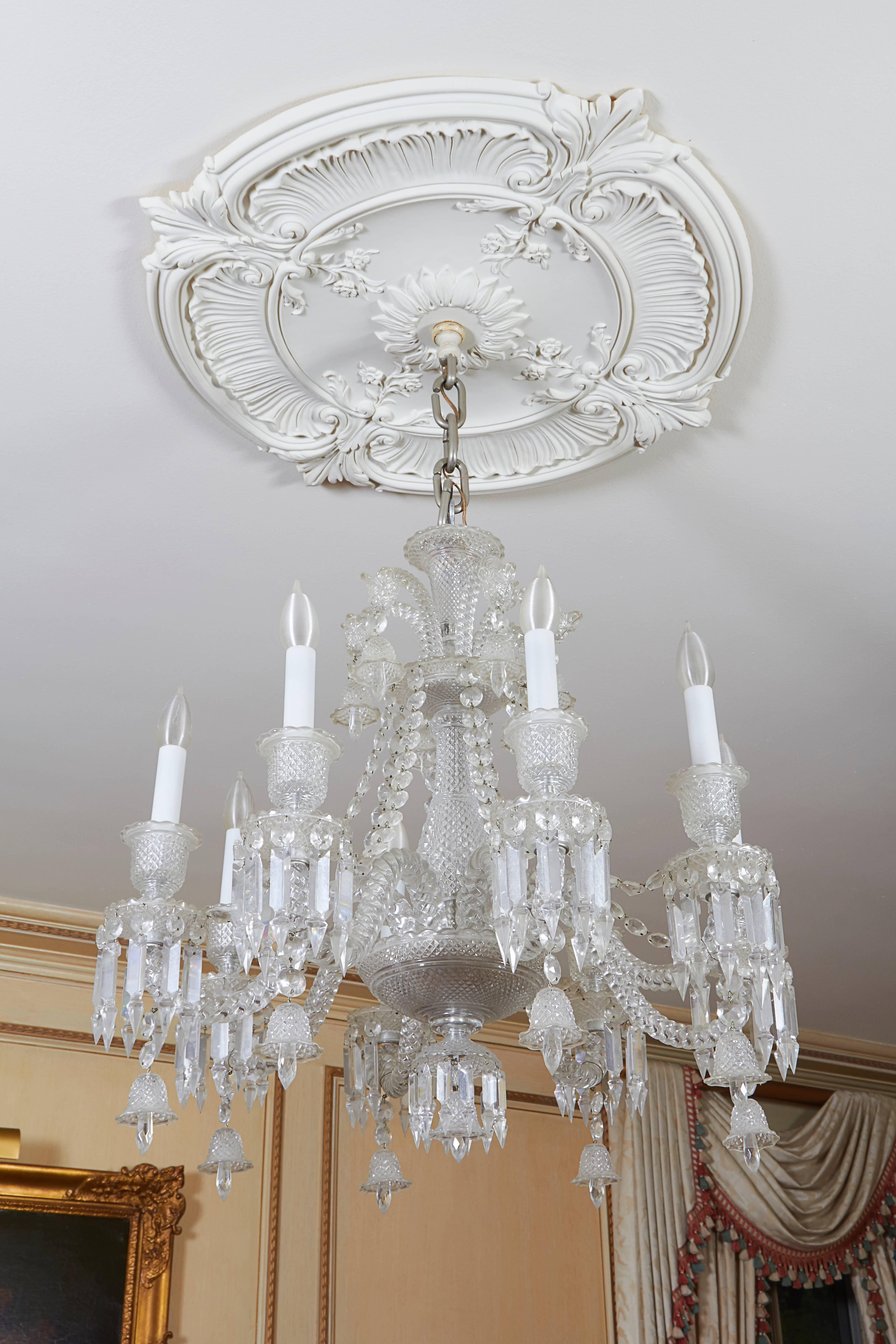 Scarce smaller scale version of Baccarat's Zenith model featuring diamond cut crystal and whimsical pendant bells.