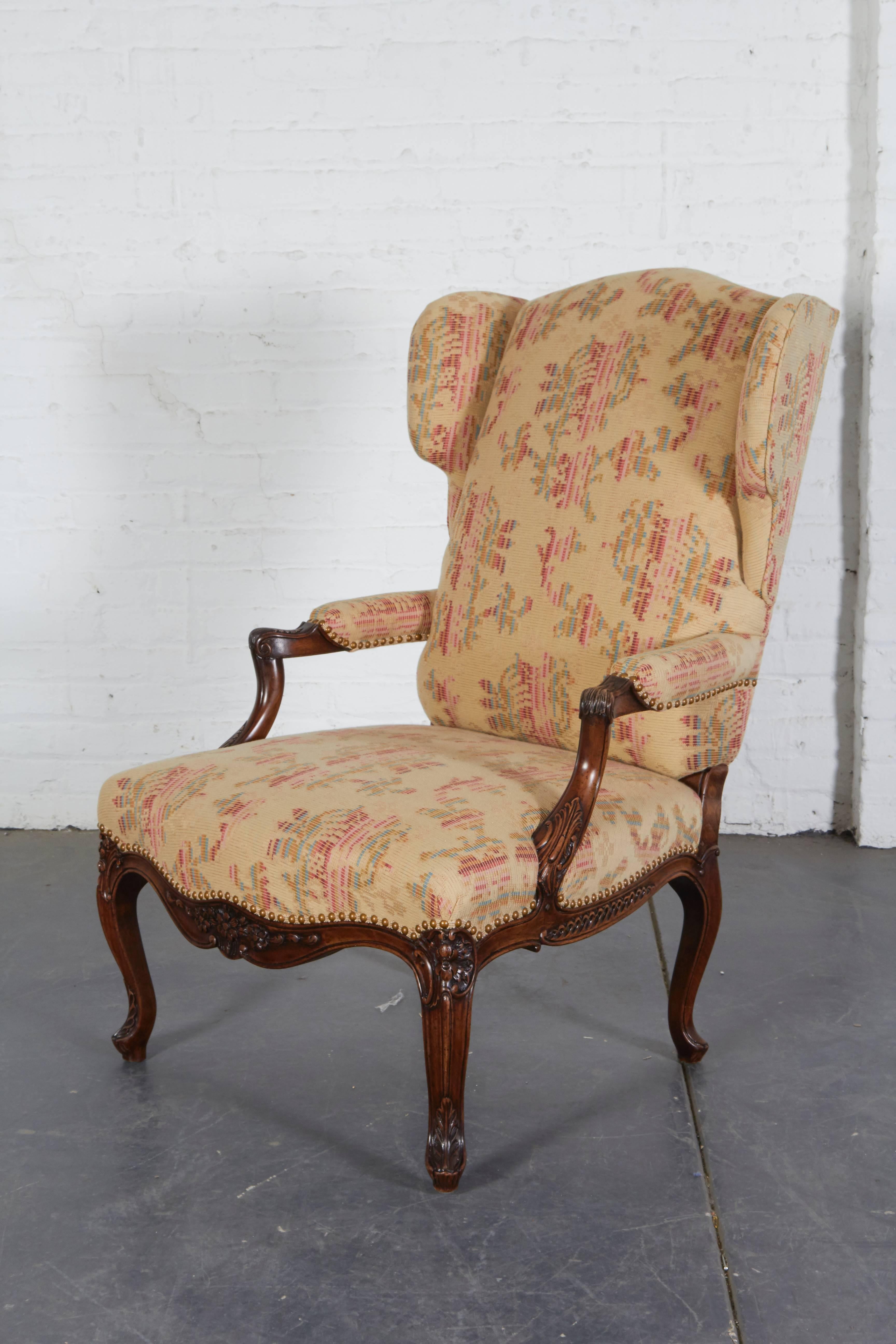 Made after an antique model supplied by interior designer David Easton for a private residence. Features fine hand-carved detailing and contrasting check-upholstered back. Another pair also available.