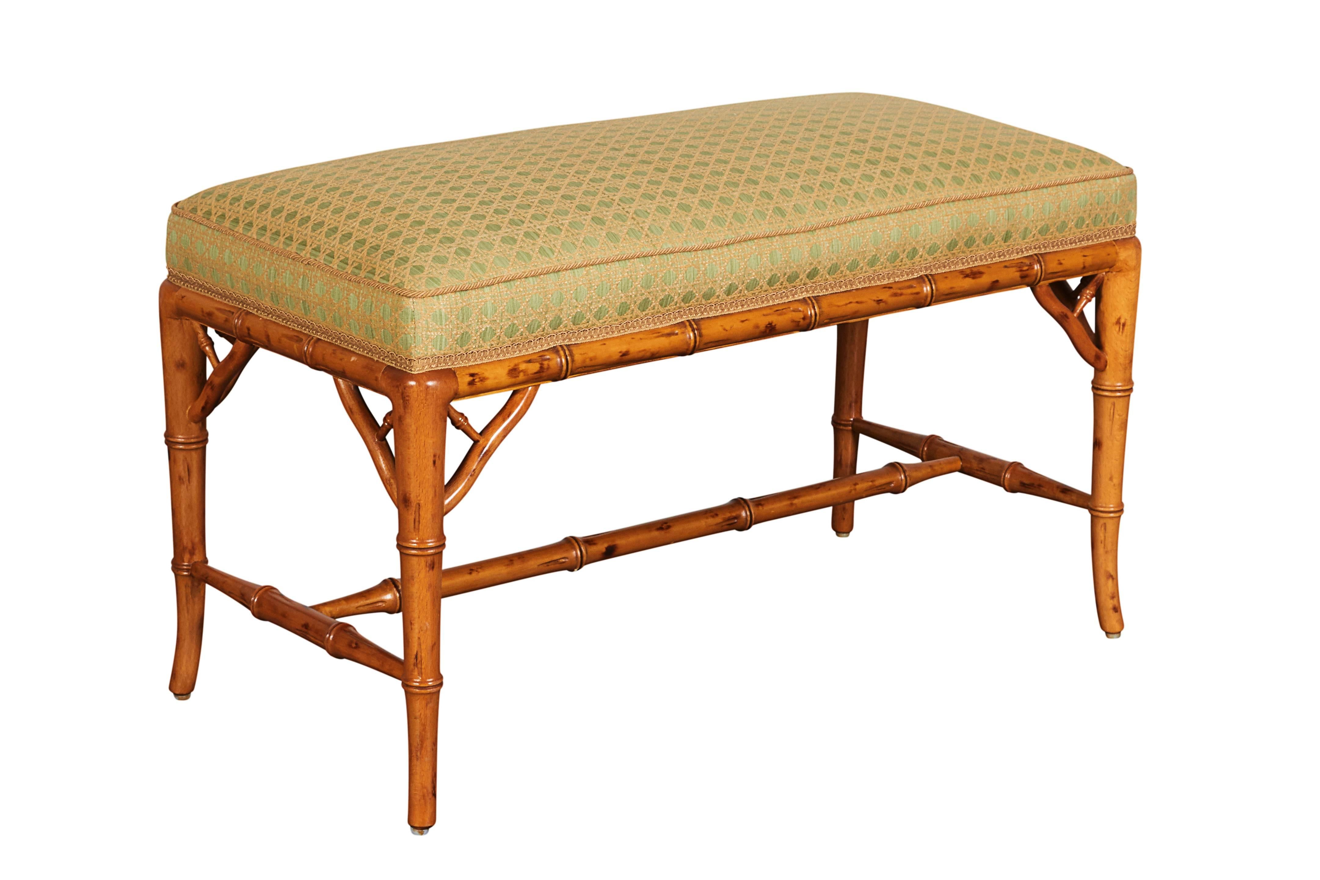Upholstered in green ground upholstery woven with goldenrod caned motif.