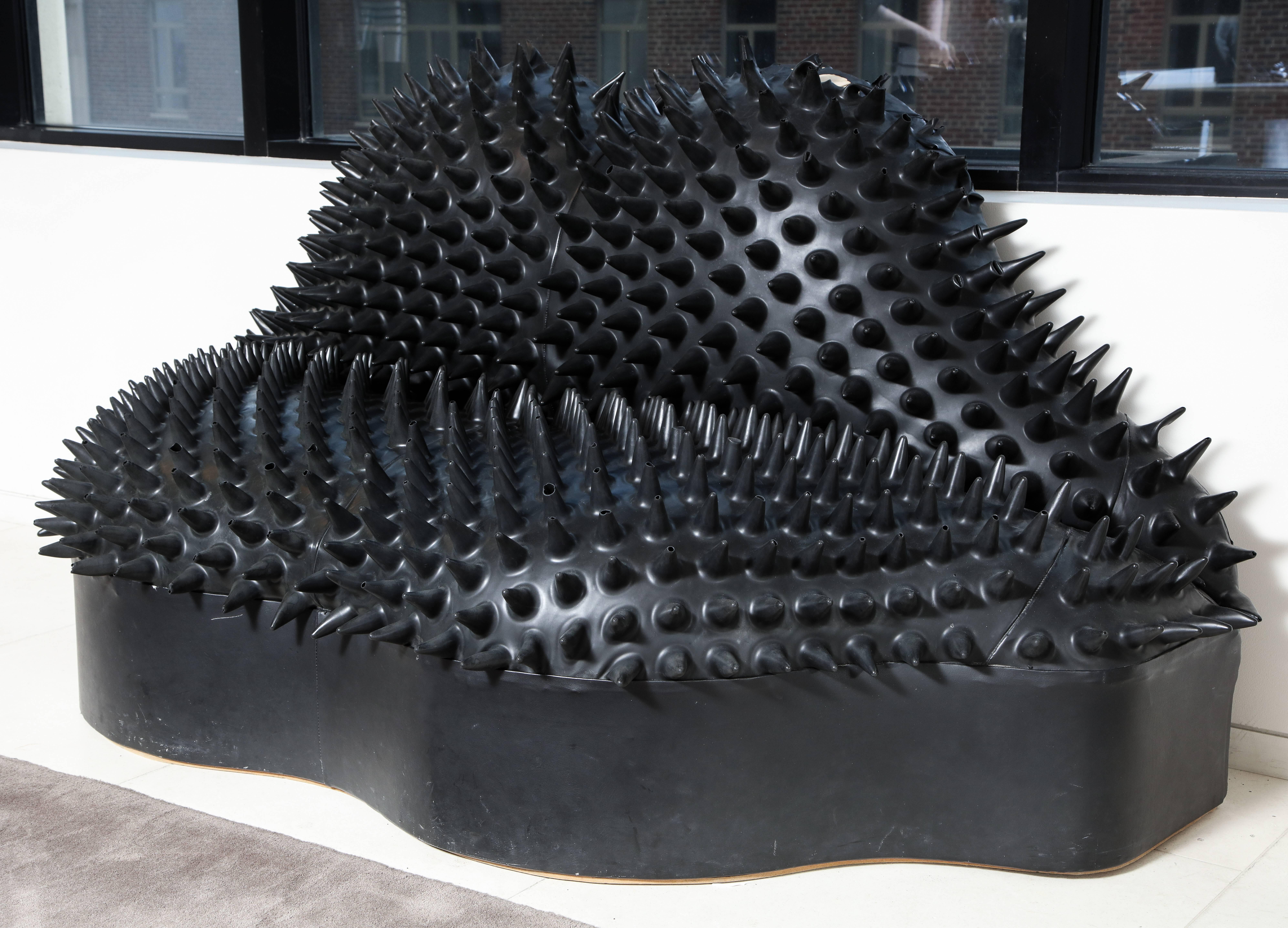Designed by artistic director Craig Morrison for MTV Europe in 1990, only a few were made in black, red and grey. This lips shaped sofa is covered in soft spikey latex, a signature material of Morrison, with a flat nylon-upholstered back. From the