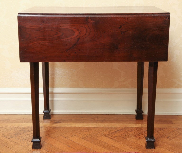 Lovely pembroke table with wonderful original surface; the top with rectangular drop leaves; over a frieze drawer; raised on square tapering legs ending in block-form feet. Width is 20.25" when leaves down.
