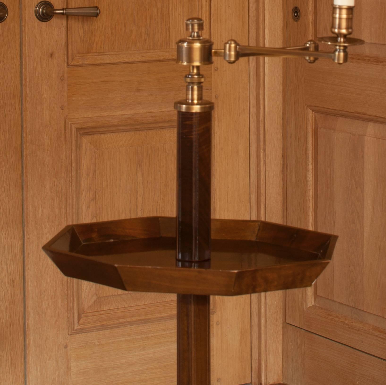 A classic design riffing on an English tripod table. With brass telescopic upright support allowing height of 48