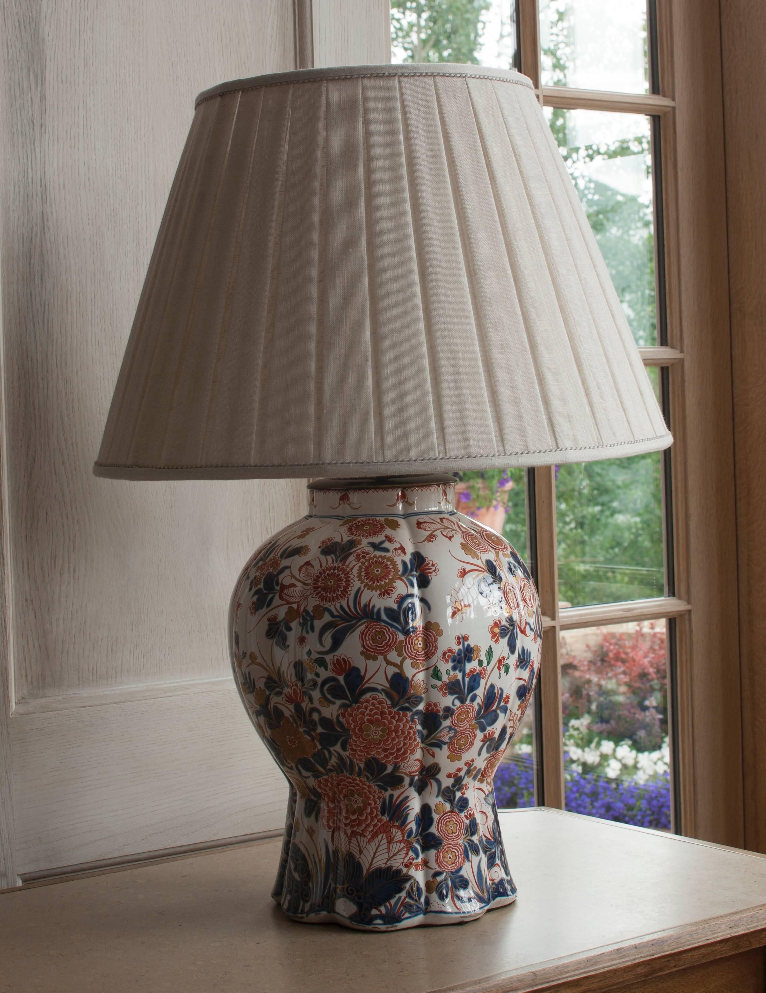With Imari decoration and custom linen box-pleated shades. Height of vase alone is 15
