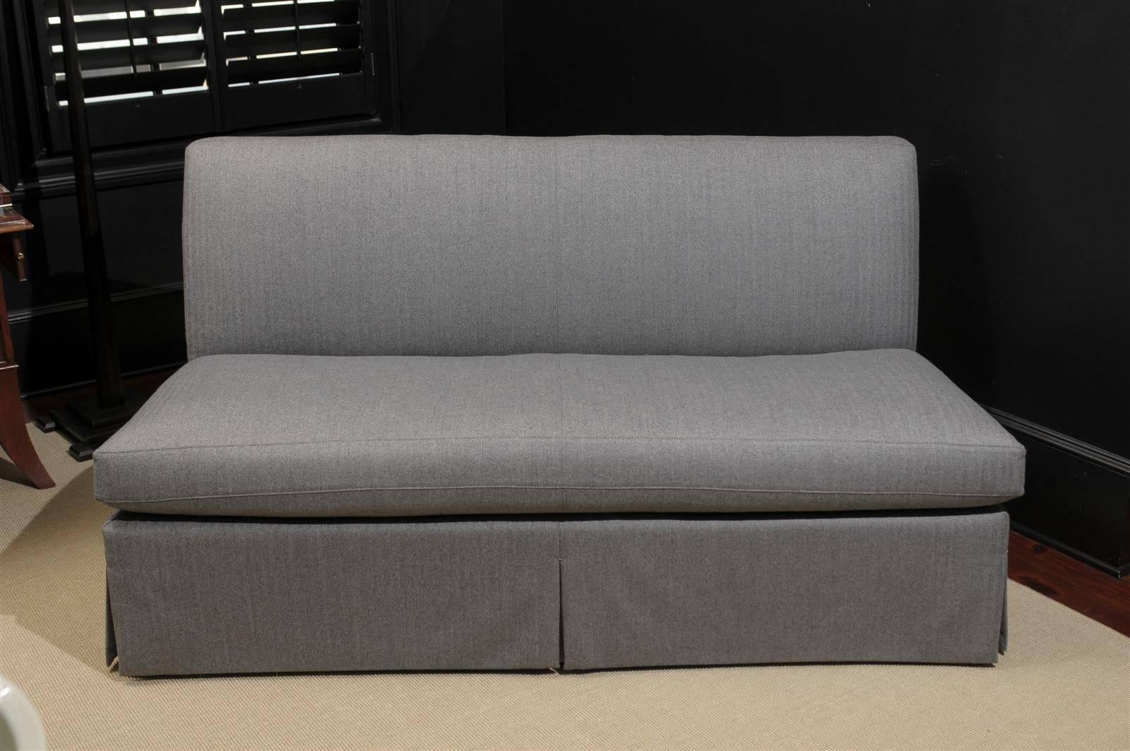 From the Robert Brown Collection, the Macrae Armless Loveseat is upholstered in Holland & Sherry Fabric.

