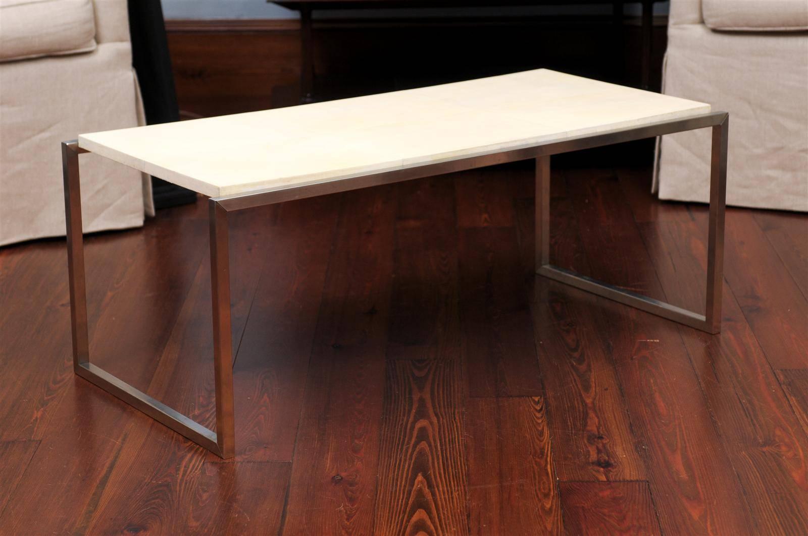 A modern parchment top coffee table supported on chrome base.
Dimensions: Height: 15.5