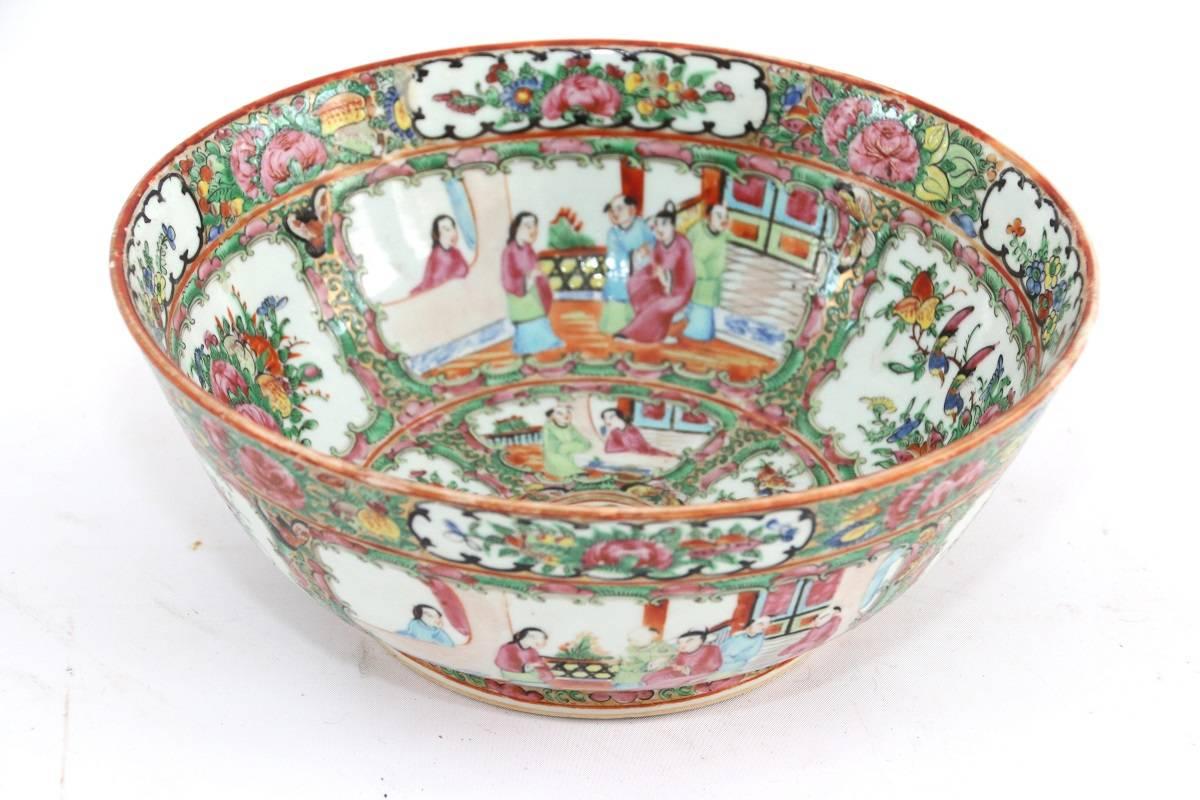 19th century Chinese Export porcelain rose medallion punch bowl with figural decoration consisting of court scenes and floral and bird decoration. 

No chips or cracks.

Measures: 4.5 inches high by 11 inches diameter.