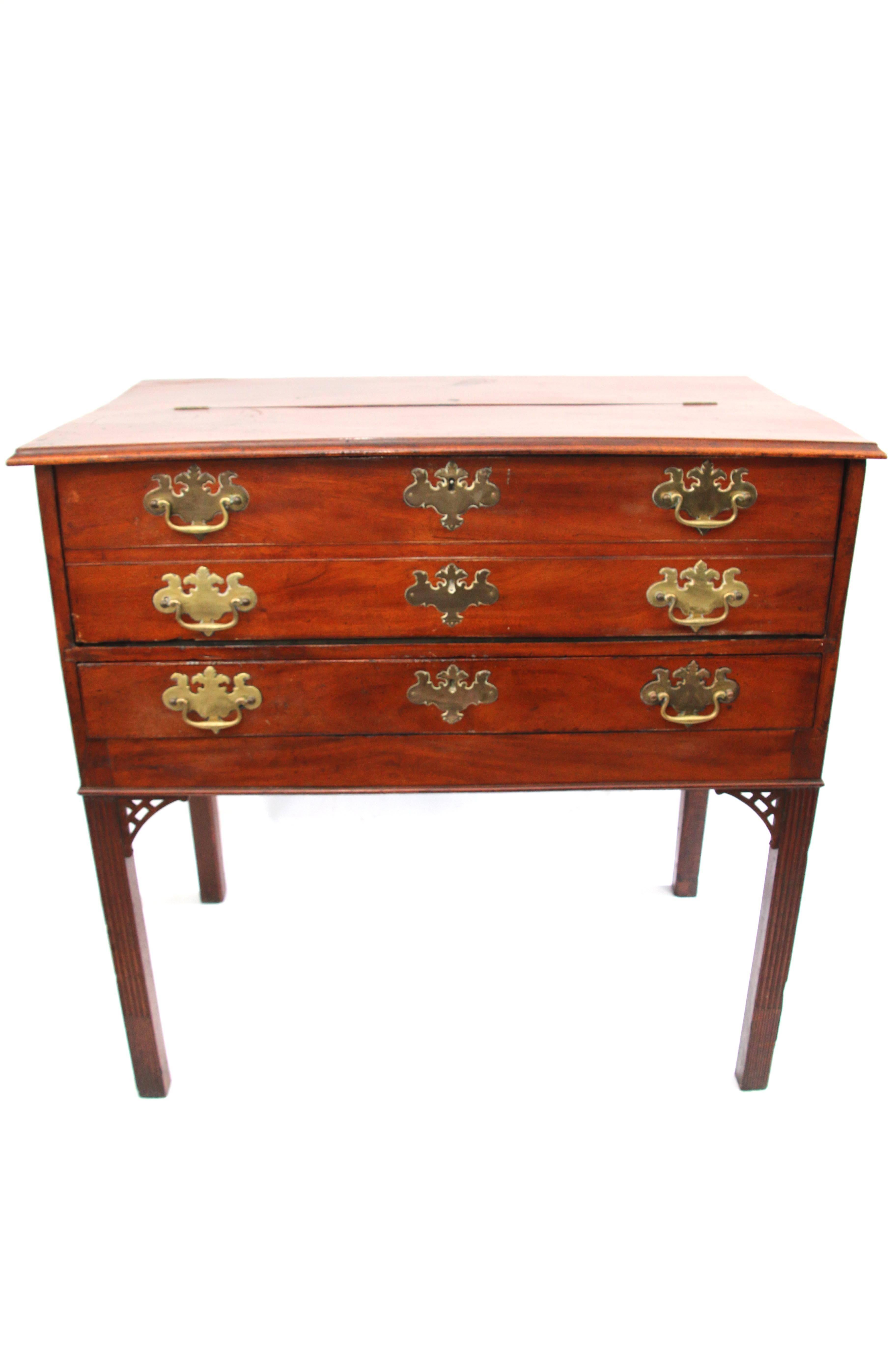 Rare form Rhode Island mahogany Chippendale merchant's desk, having a split hinged molded top possessing a mirror, faux two-drawer front hinging down to reveal a writing surface with beautifully fitted interior, a single working partitioned drawer