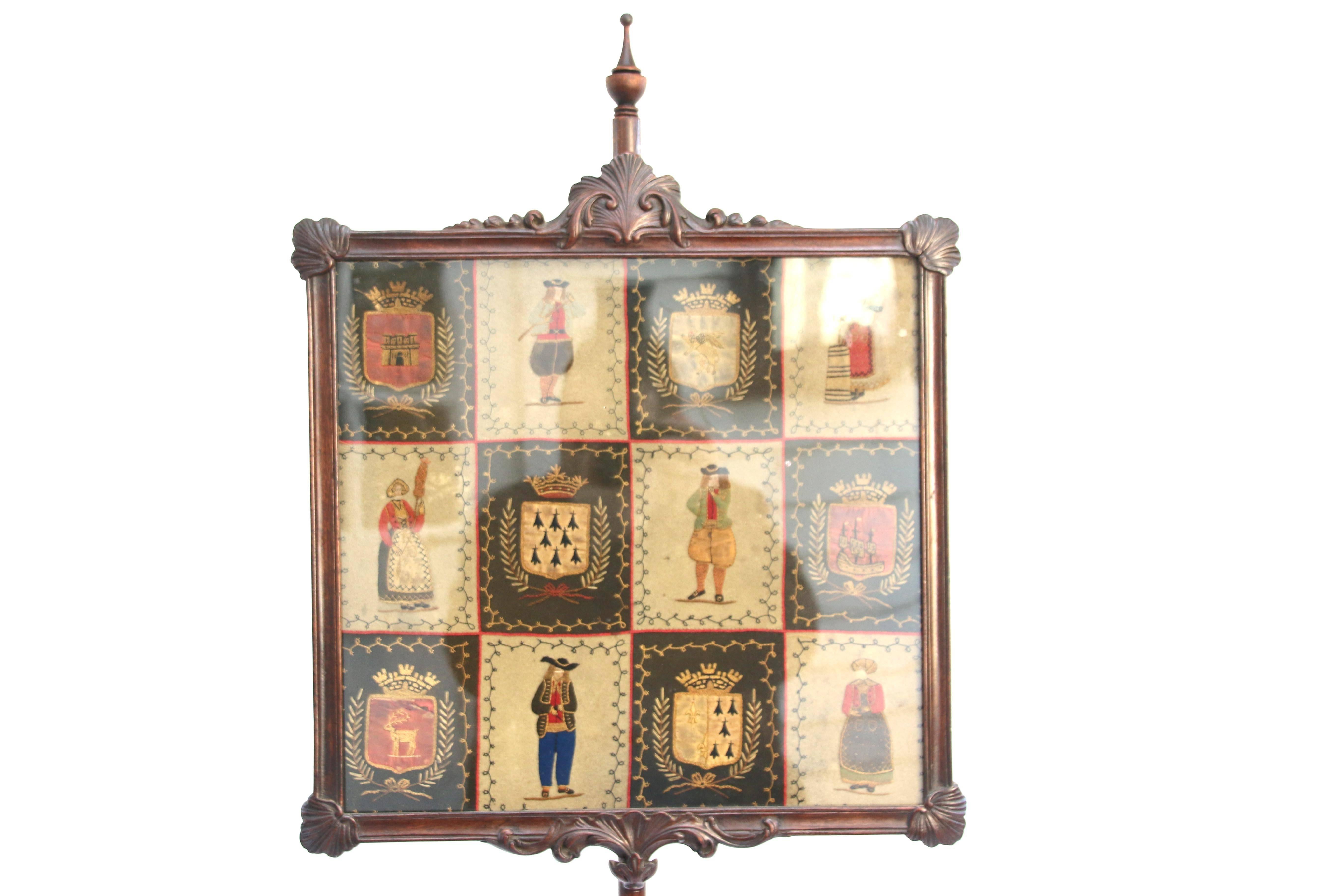 Massachusetts Queen Anne Cuban mahogany pole screen retaining an old surface with original rare needlework depicting multiple marriages within the same family in a square shell and floral carved motif frame joined to a bulbous spiral-reeded urn form