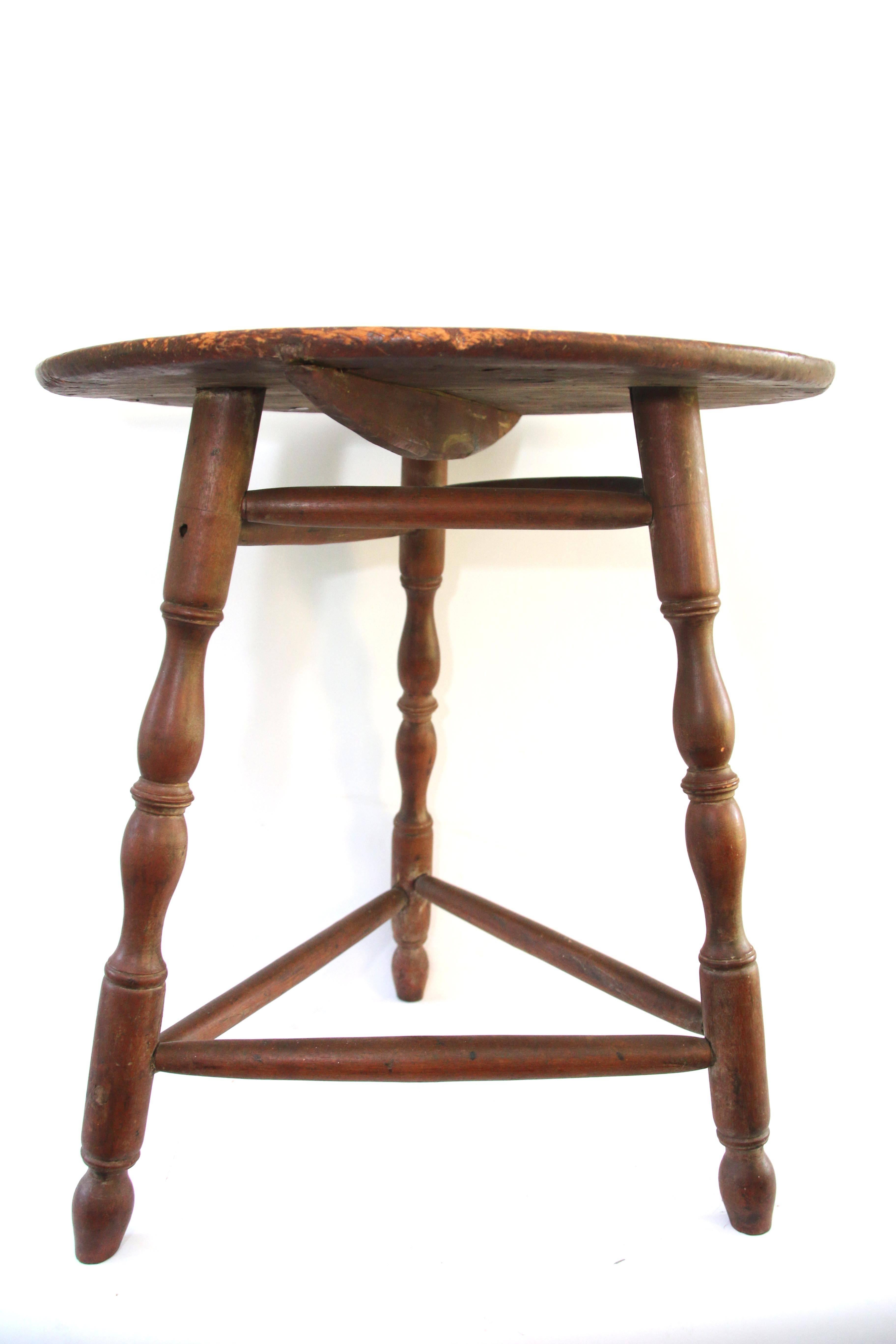 Red-painted table with circular top on tripod base of splayed vase-and ring-turned legs ending in turned feet, joined by double stretchers. Old surface. Minor imperfections. 

Top is original but has been rotated.

Late 18th century,