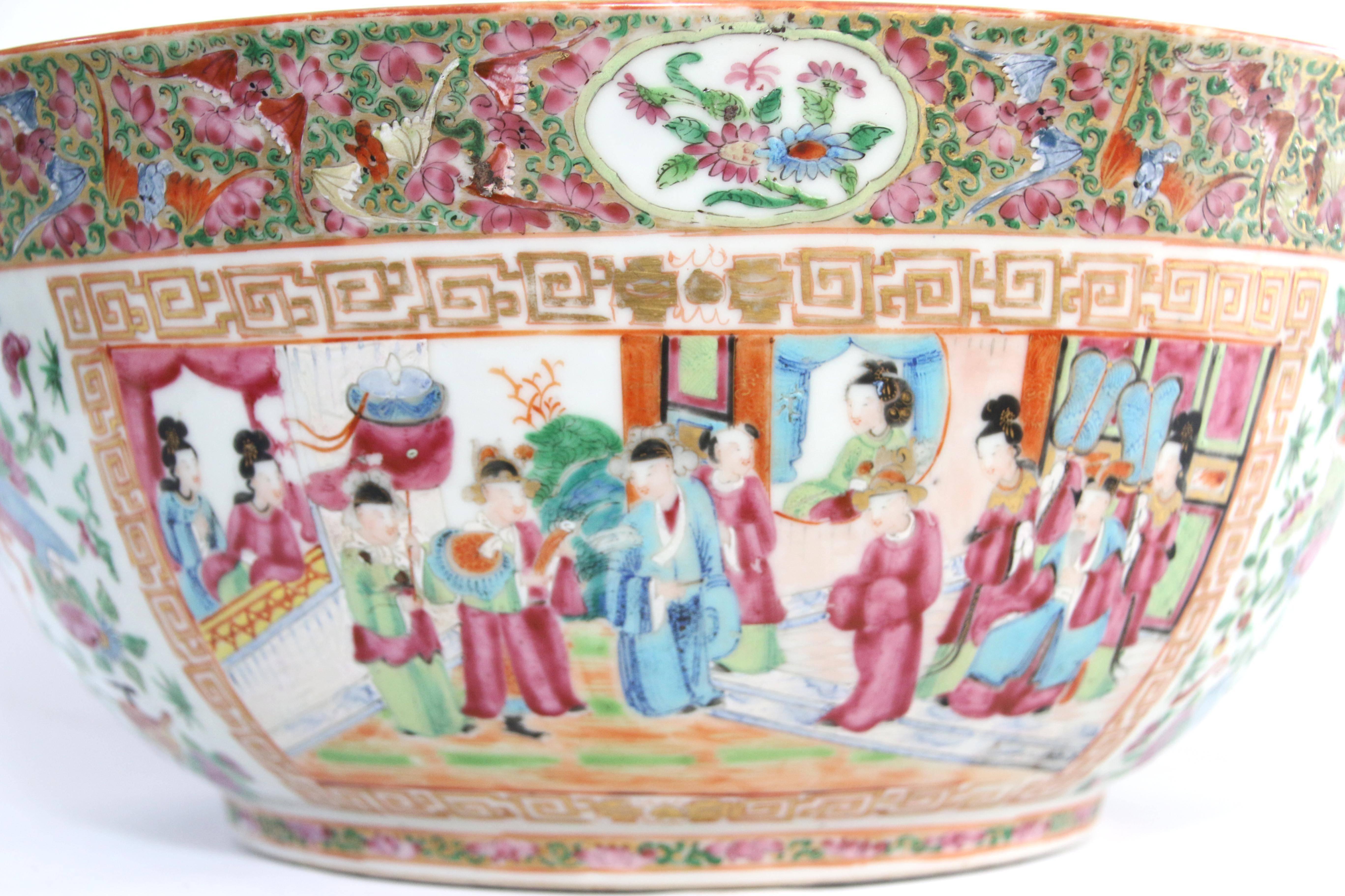 Rose Mandarin porcelain punch bowl, China, 19th century, polychrome enamel-decorated with panels of figures in courtyard settings framed by bands of foliage and ornaments. 

Approximately 6” height x 15 ½” diameter.
