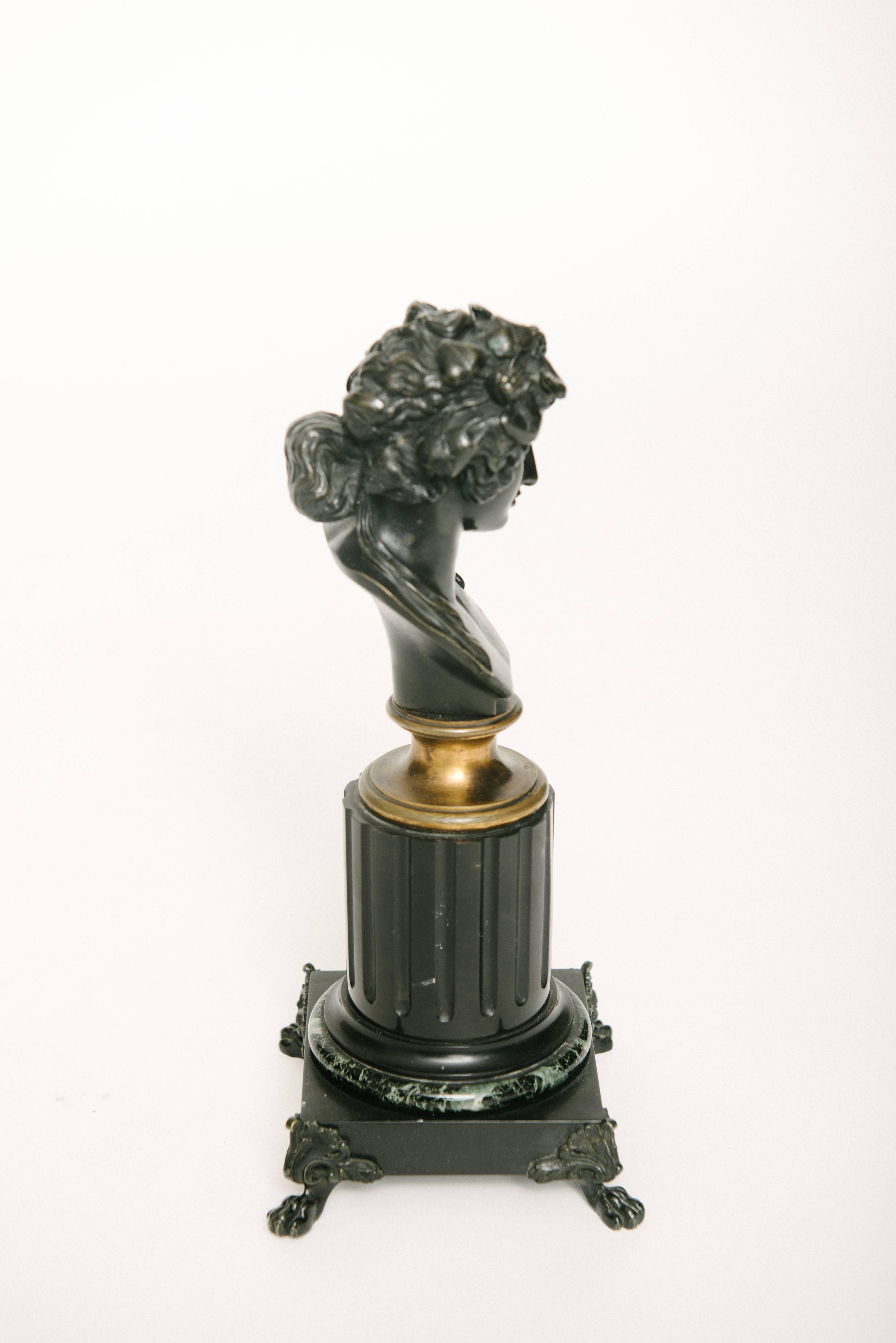 Pair of 19th century French patinated bronze busts on marble bases.