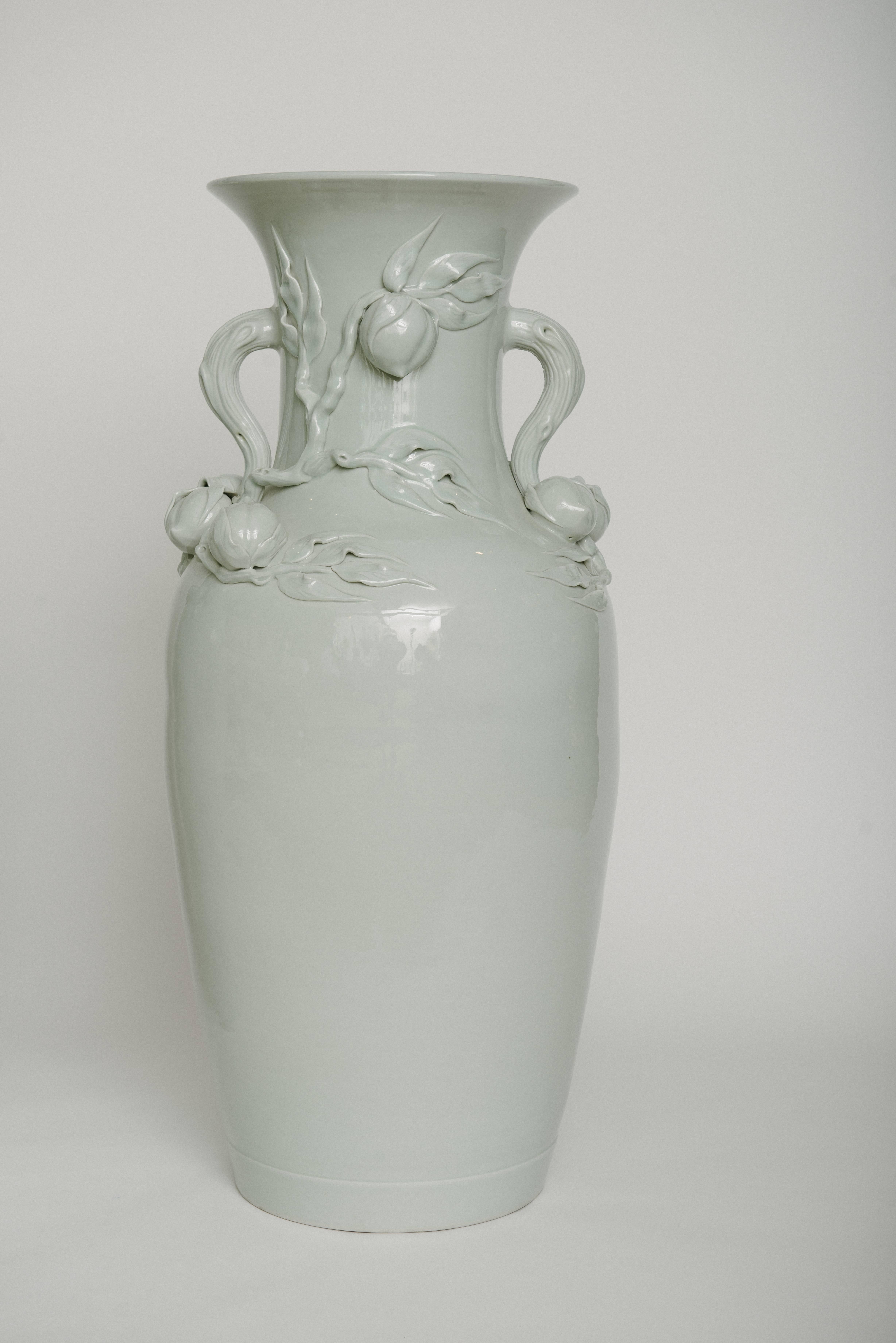 A tall pair of Chinese white celadon peach vases, measures: 37