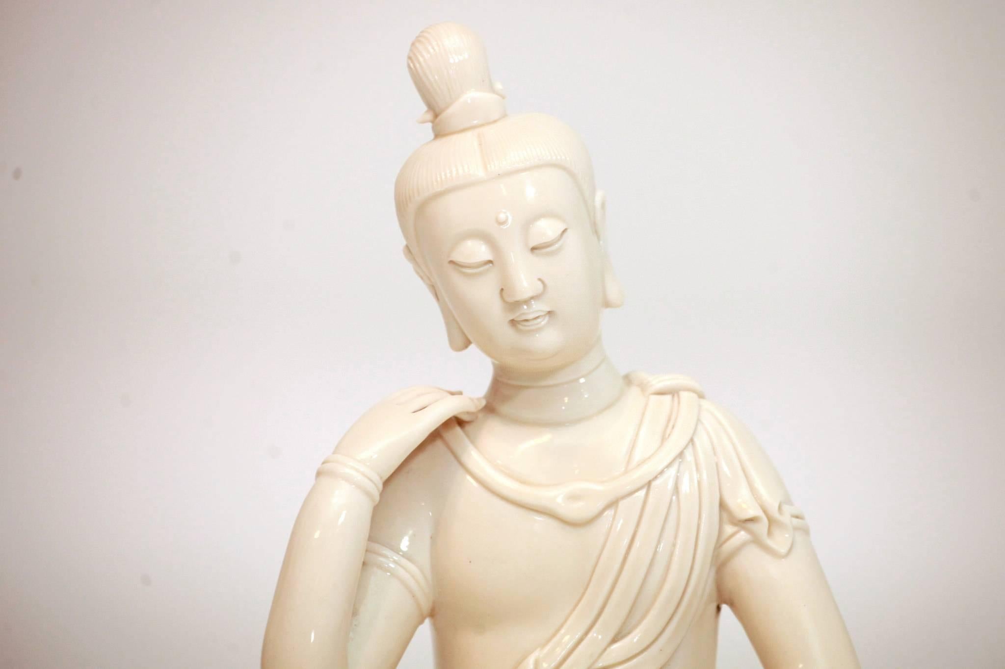 A handsome 20th century Chinese porcelain Guanyin (Quan Yin,) signed.