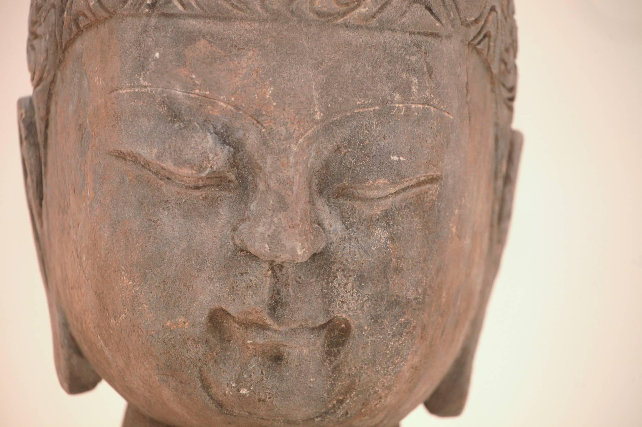 A large 20th century Chinese carved blue stone Buddha head from the Fu Jian Province, circa 1980s.

Base dimensions: 4