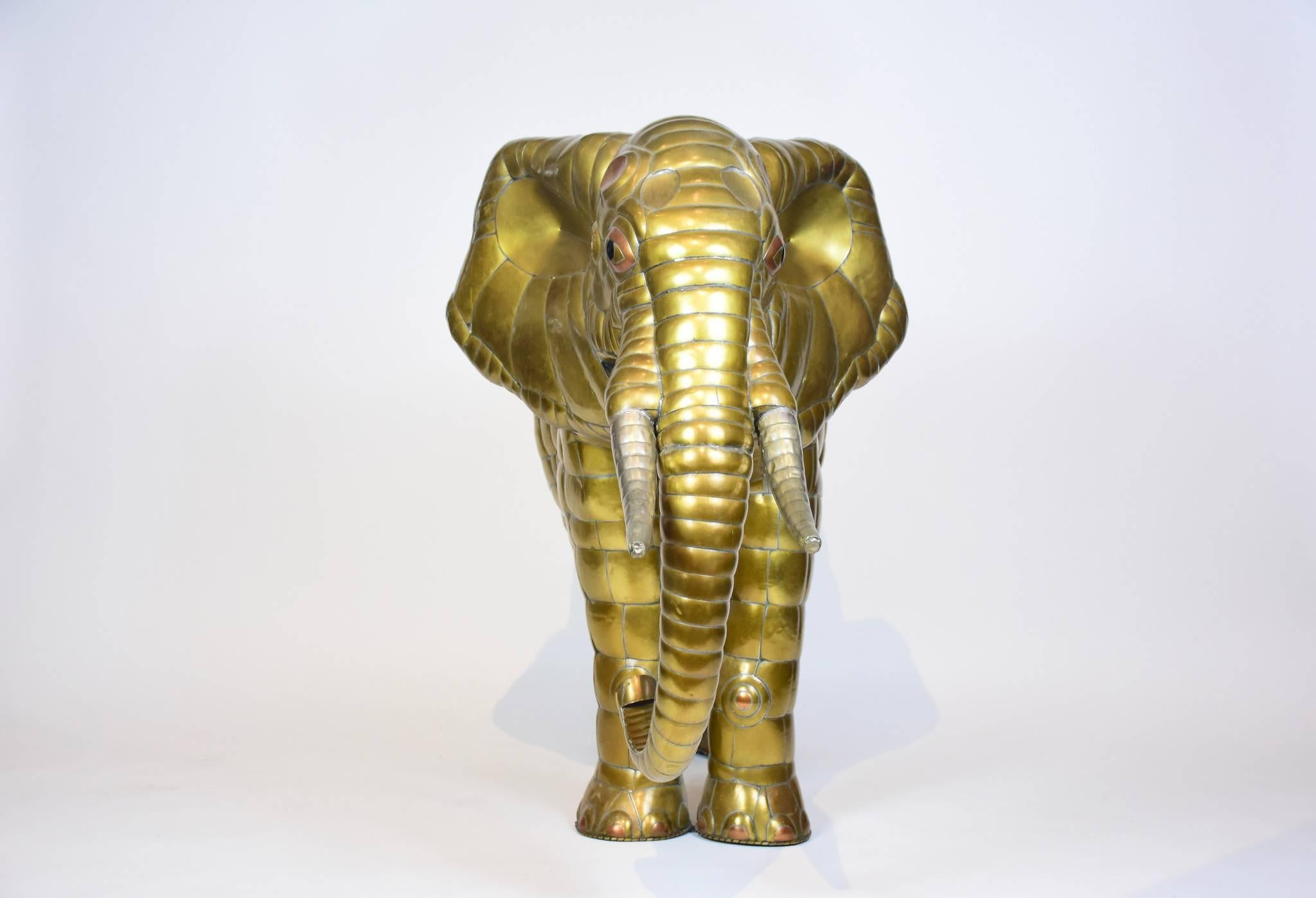 Elephant sculpture in patchwork brass and copper by acclaimed Mexican artist and sculptor, Sergio Bustamante. This was done in the late 1970s. Tons of handcrafted detail which defines this piece.
