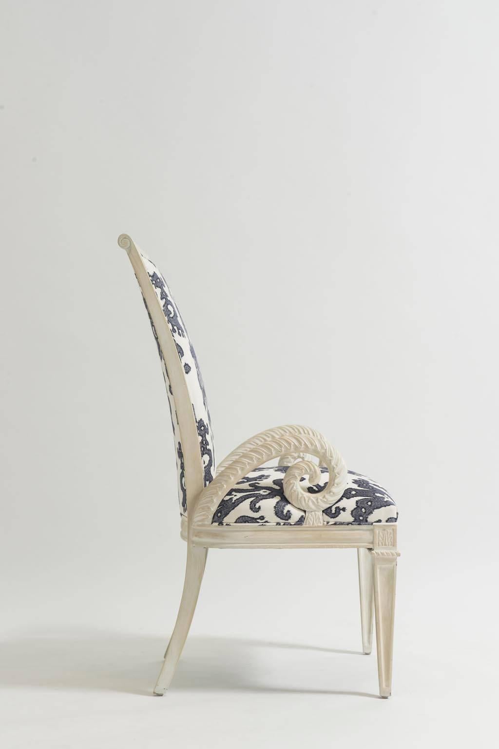 Pair of Dorothy Draper inspired Hollywood Regency plume form armchairs. Newly upholstered in an embroidered ikat fabric.