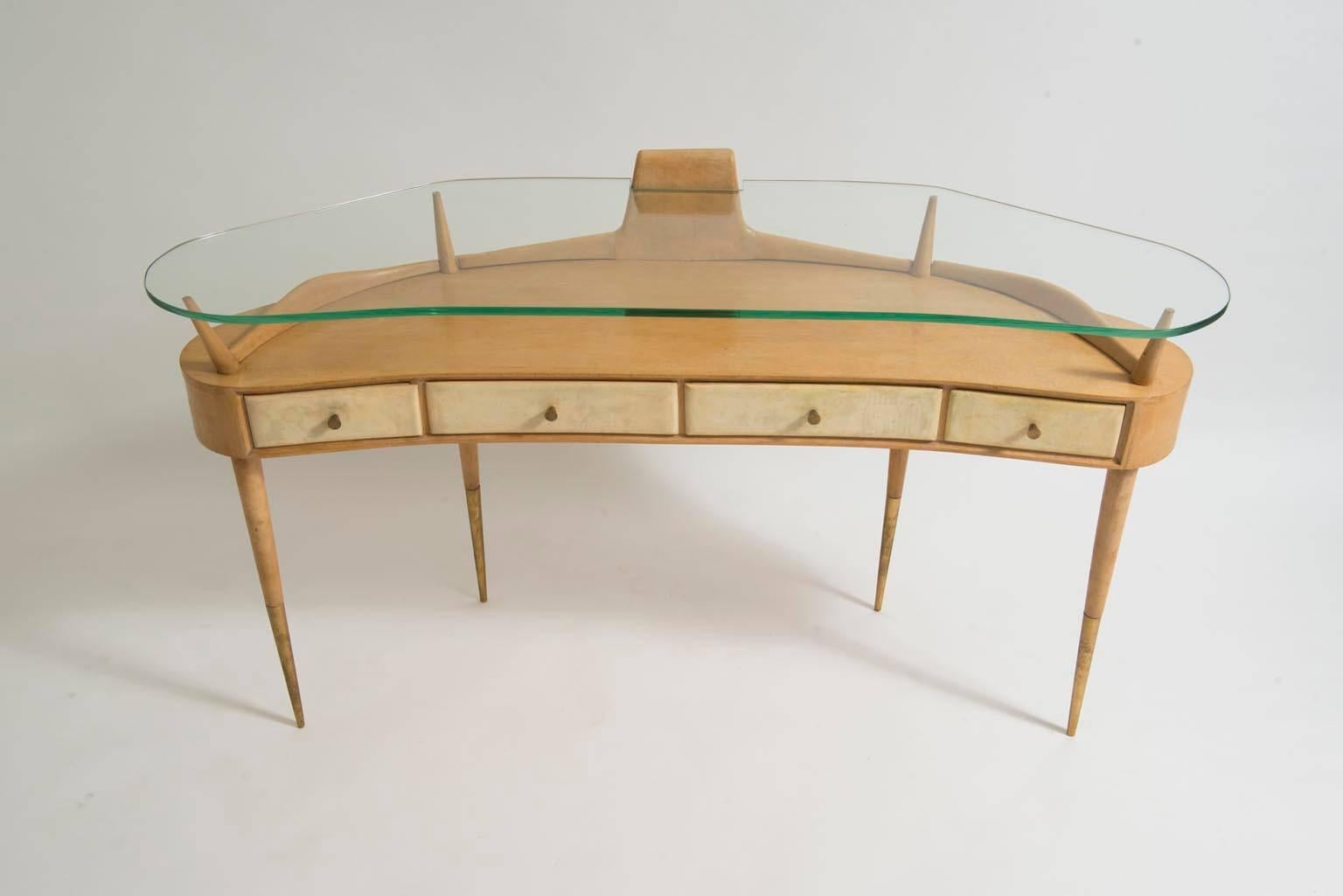 Chic, Gio Ponti attributed mid-century modern birch and maple vanity table or console table with glass top, four drawers, brass feet and hardware, circa 1950.