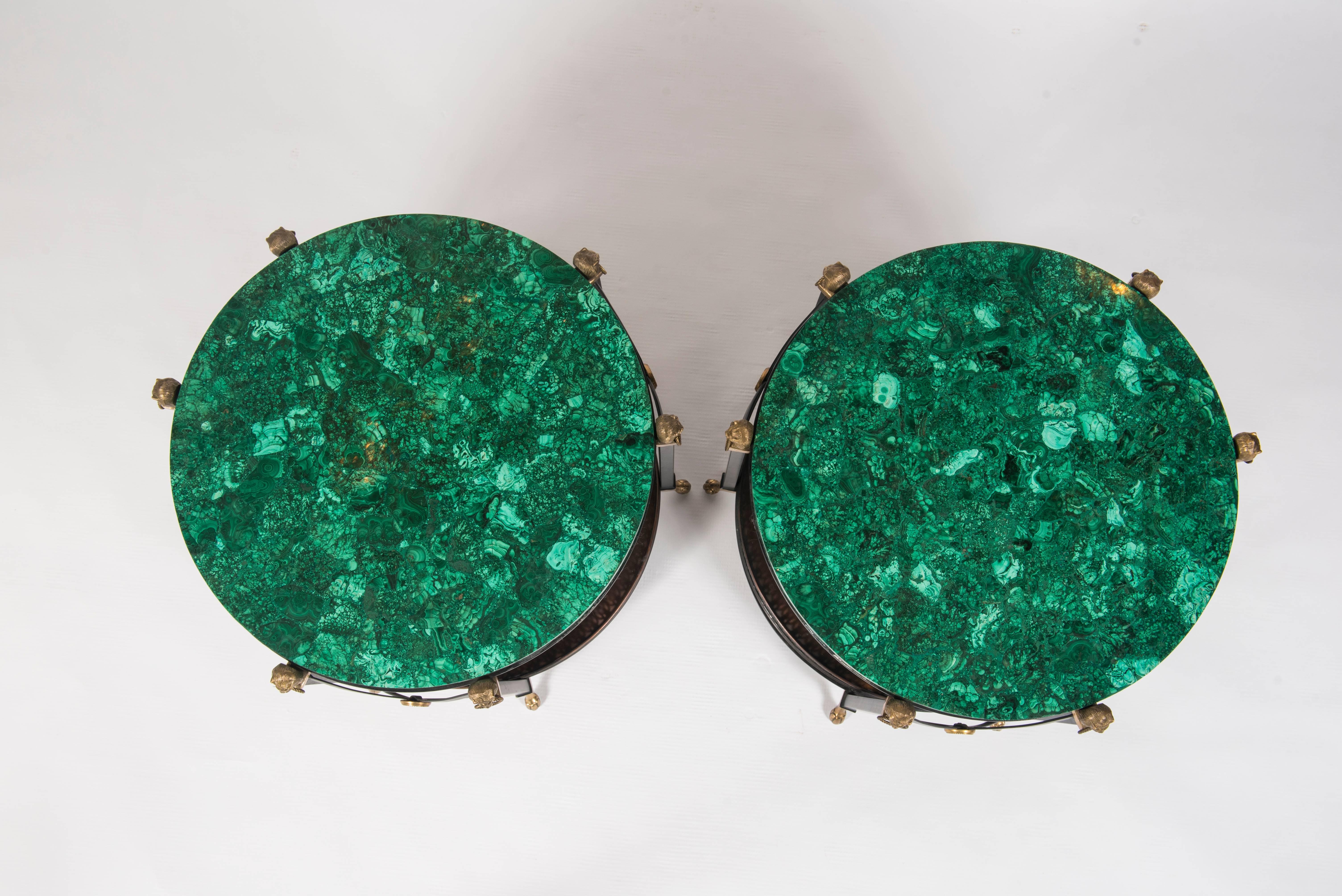 A pair of timeless Directoire style black enameled iron gueridons with beautiful bronze detailing and malachite tops.