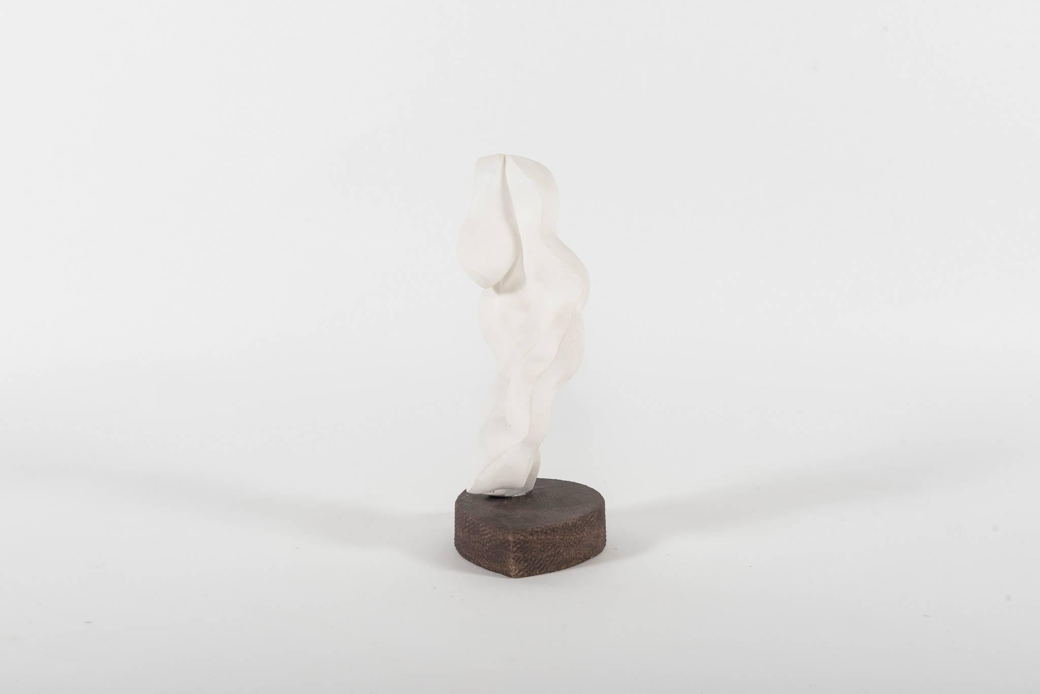 A lovely vintage white biomorphic plaster sculpture on artist's base. This abstract sculpture is in two pieces, the body is dowelled at the bottom which fits into hole in the base, and is signed HN '91.