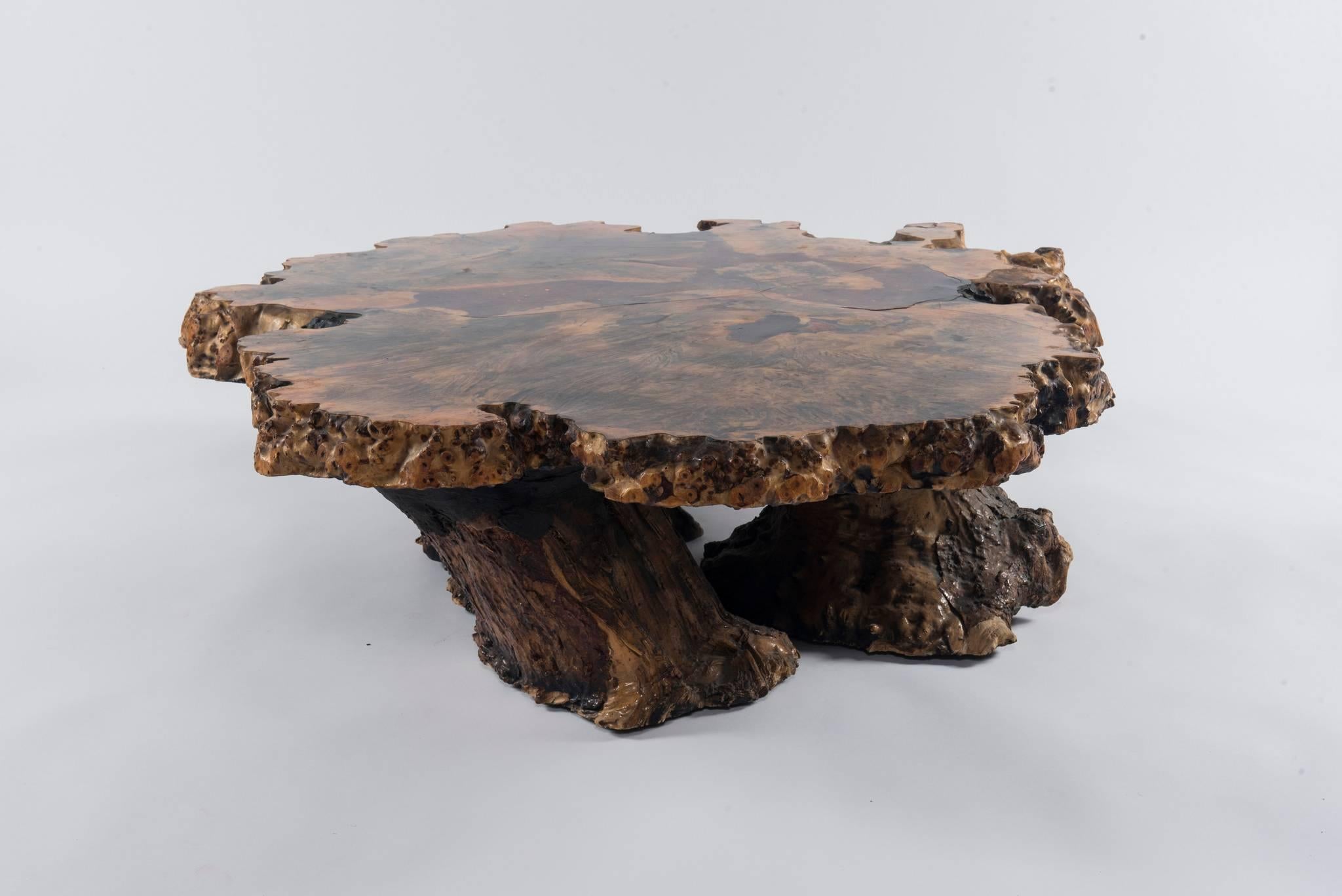 An original star dust table No. 74941 by the Burlwood Co, Redding, California.

This fabulous burl elm table has a seam of mica, citrine crystals and other gems running through the middle section and is larger than most similar tables. It measures