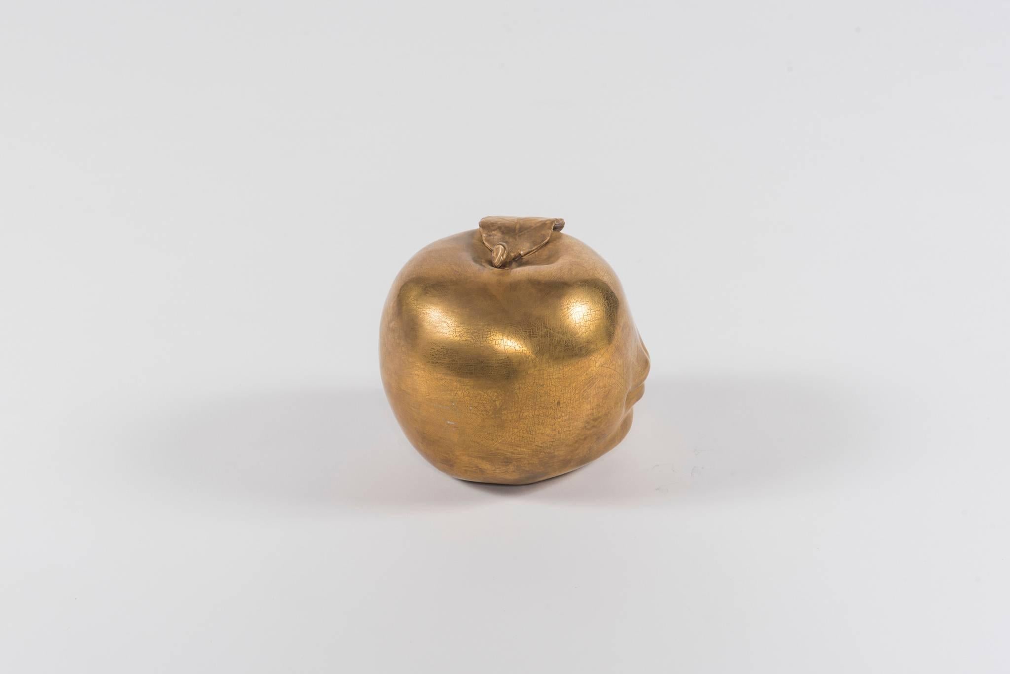 A surreal 22-karat glazed bisque pommel apple in the style of Lalanne. A perfect bibelot for any table, mantle or shelf.
 
Approximately 7 inch diameter x 6.75 inch height.
    
