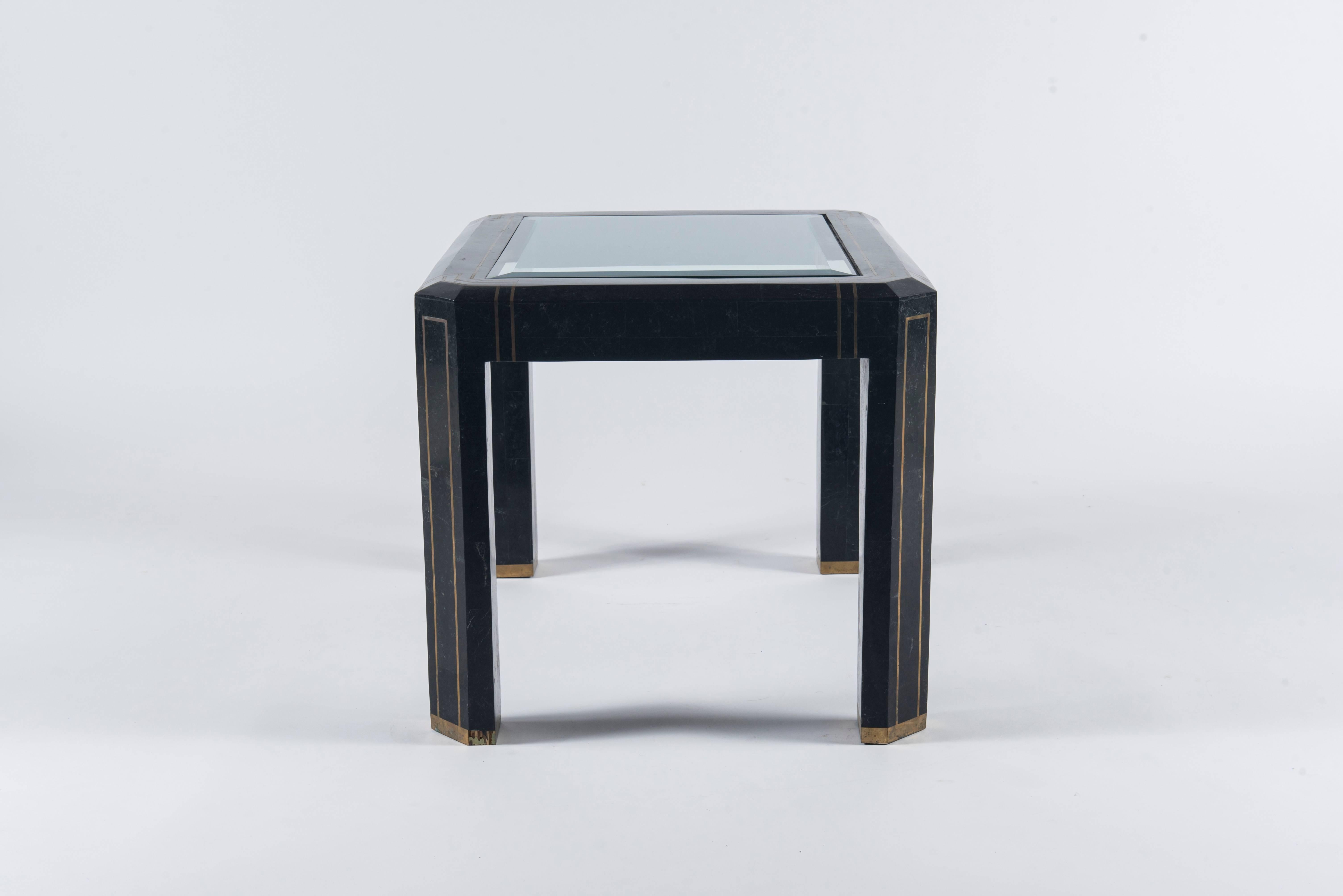 A vintage Maitland Smith style tessellated black marble and brass occasional table.