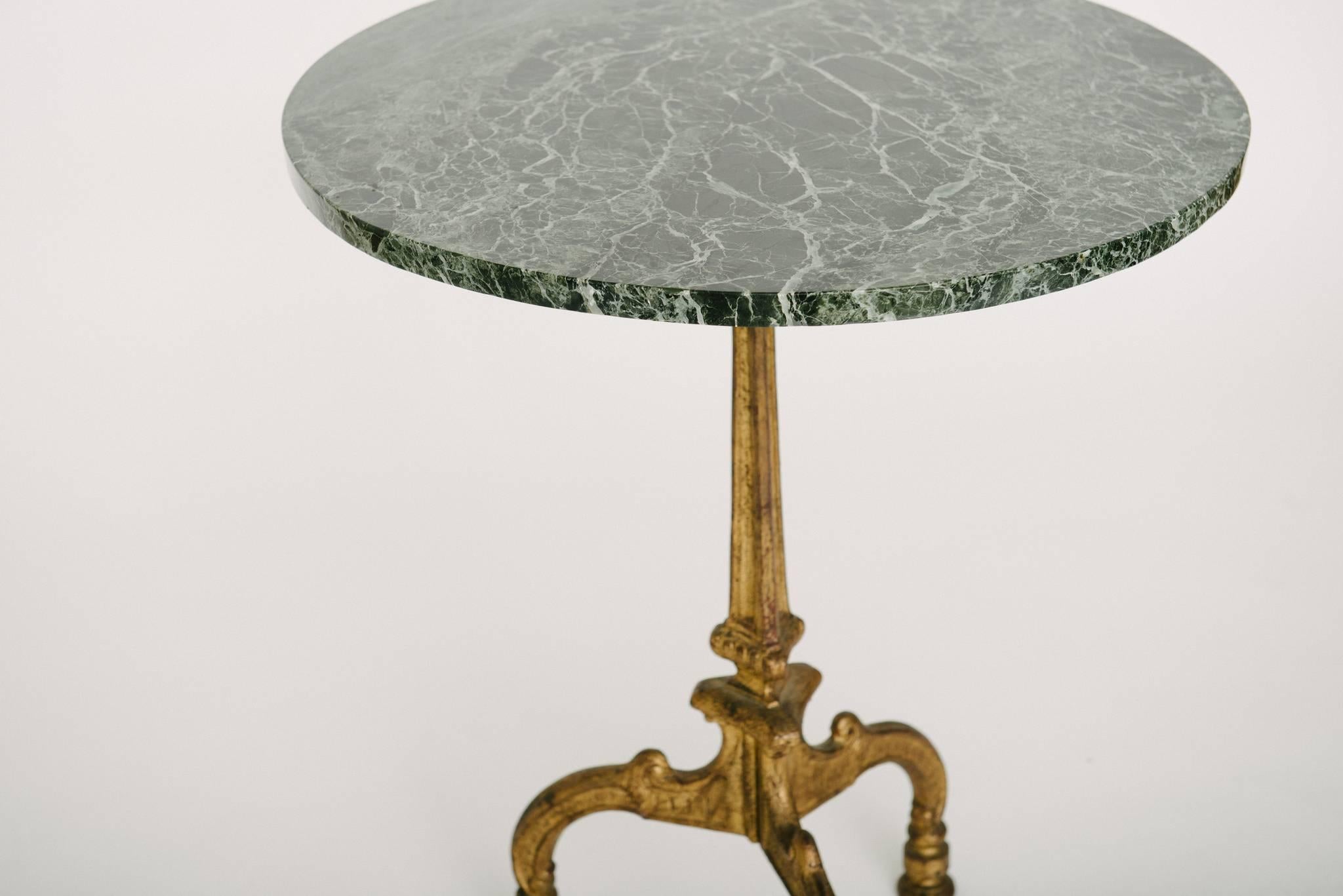 Antique French gilt iron Neoclassical style gueridon with green marble top.