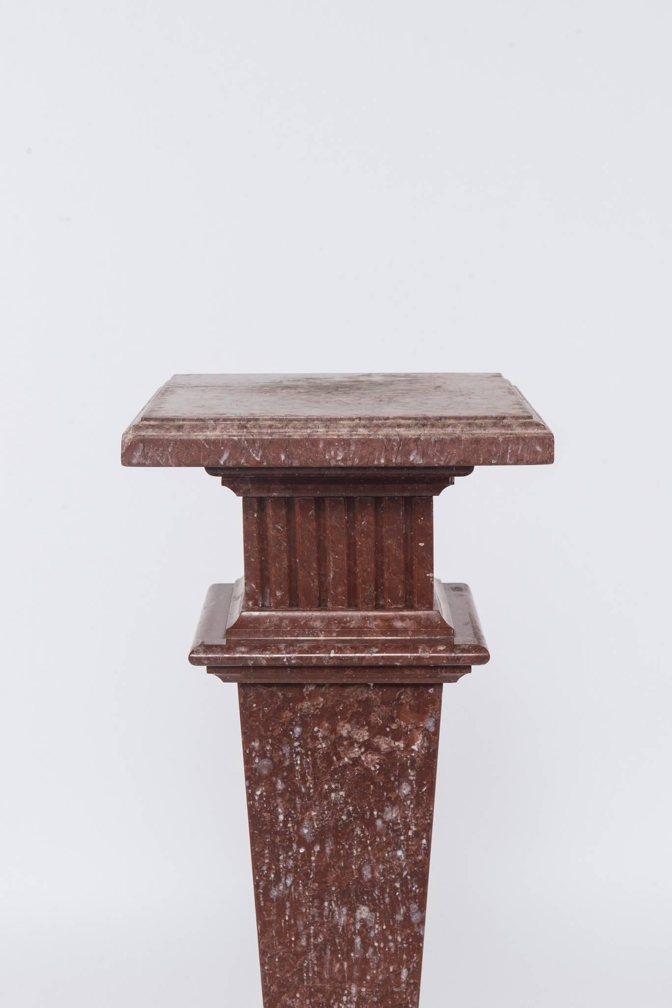 An early 20th century neoclassical style red/rouge marble pedestal.