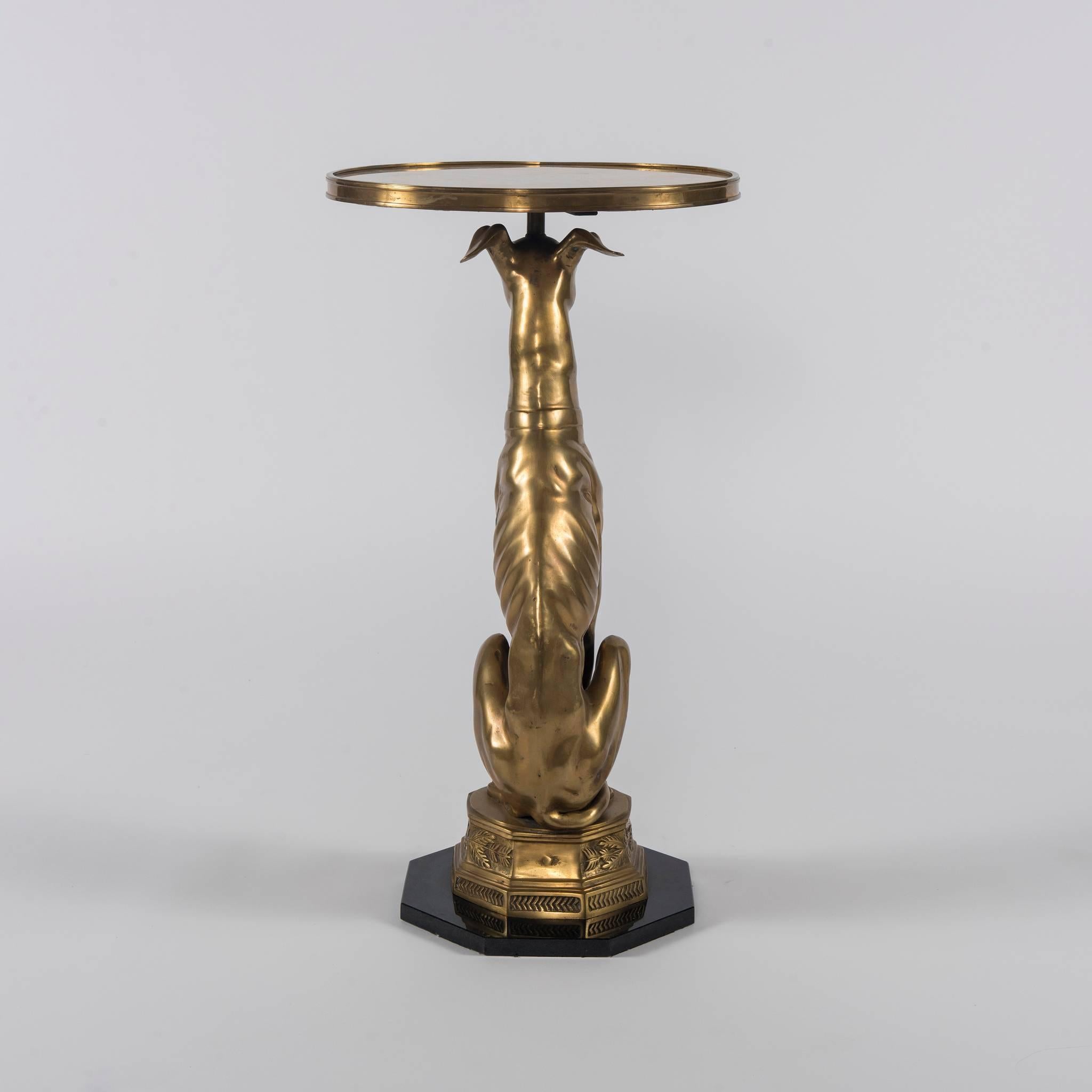 A vintage Hollywood Regency brass and onyx whippet occasional table.