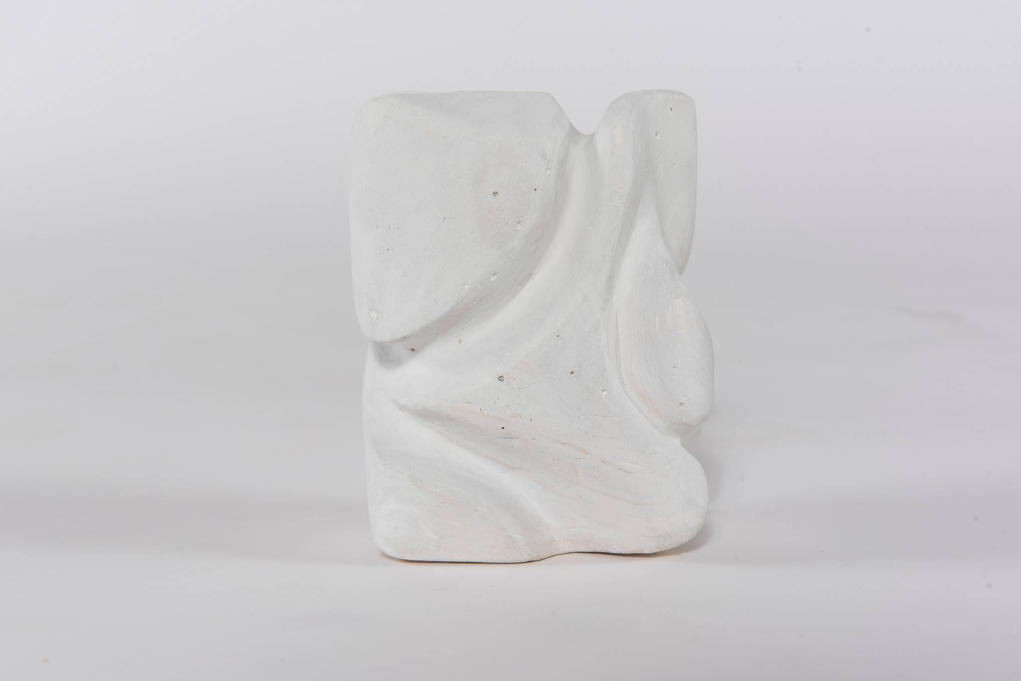 A vintage signed white plaster contemporary sculpture.